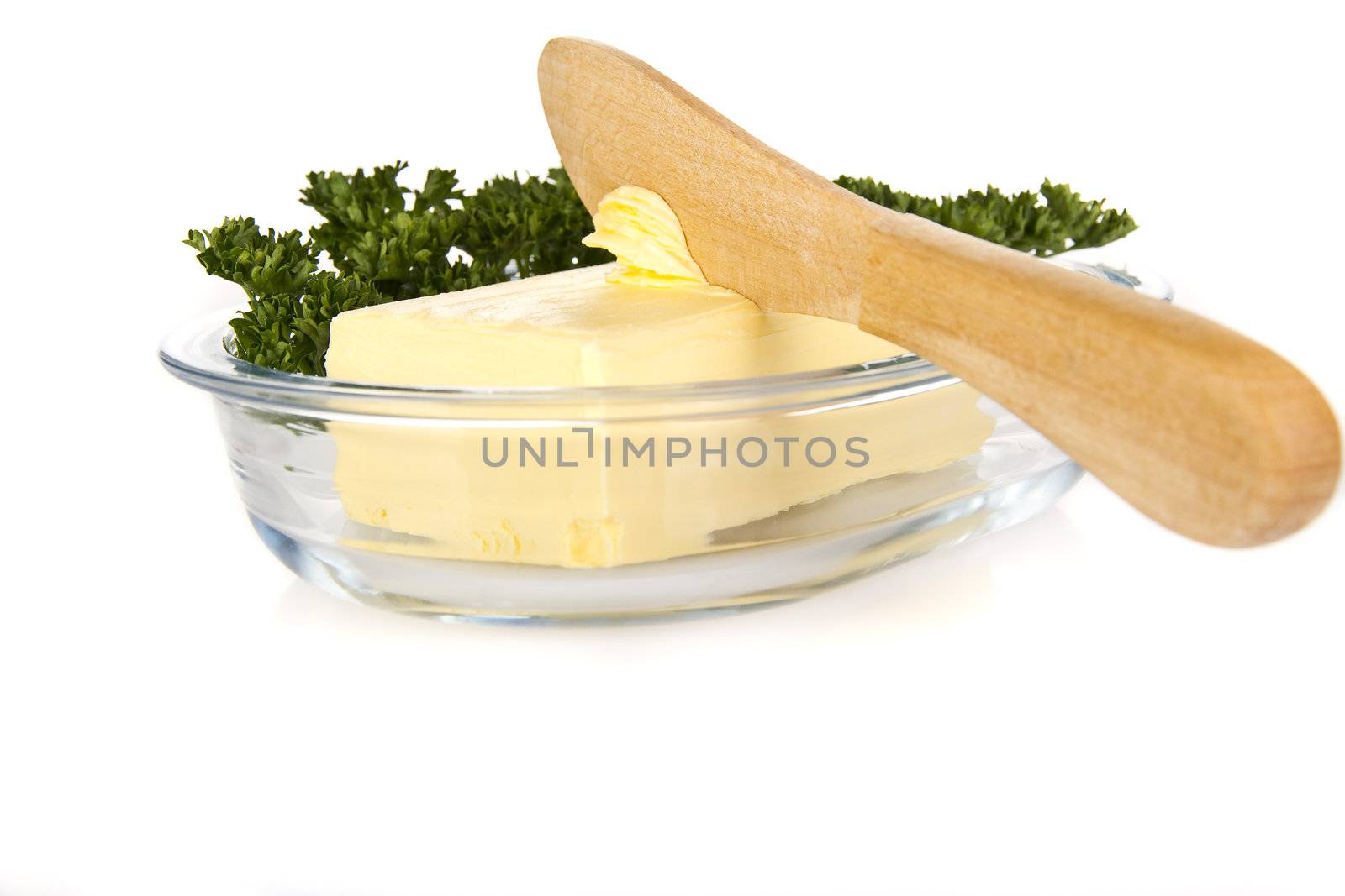 Butter with knife on the plate - isolated