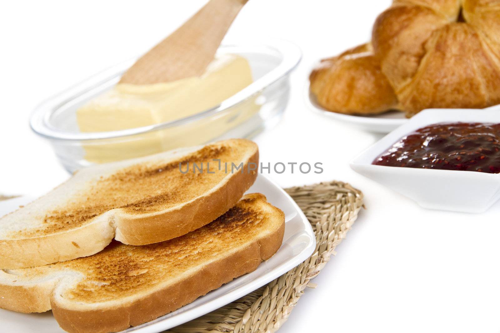 Toasts with butter jam and croissants - isolated