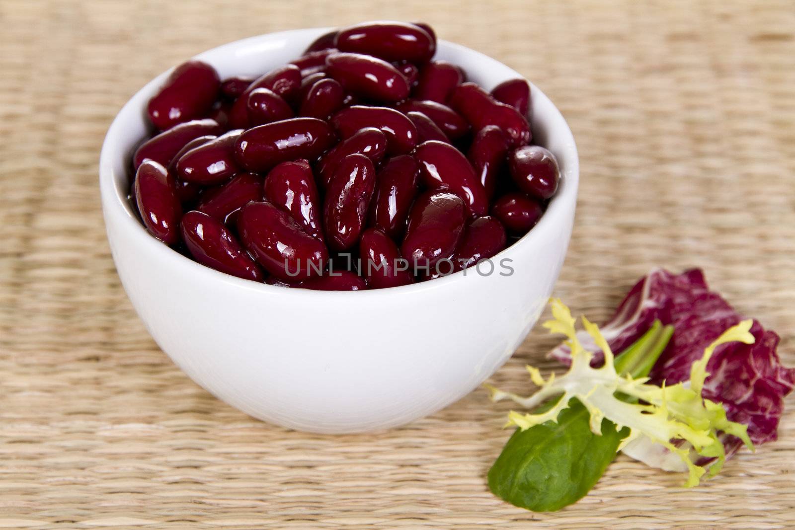 Kidney Beans in the bowl with fresh salad leaves