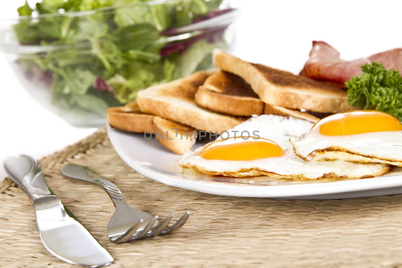 Breakfast with eggs bacon beans and toasts