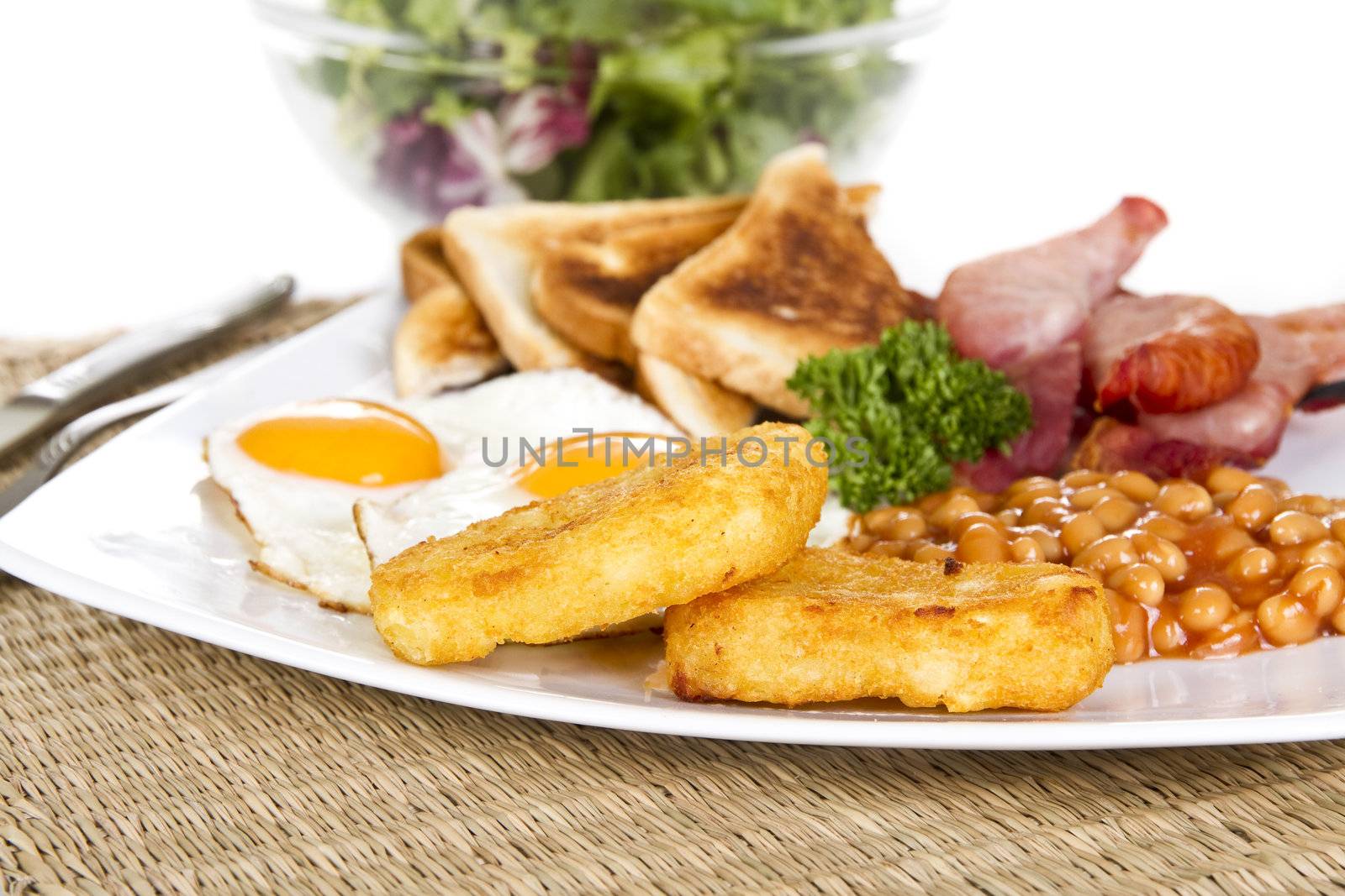 Breakfast with eggs bacon beans and hash browns