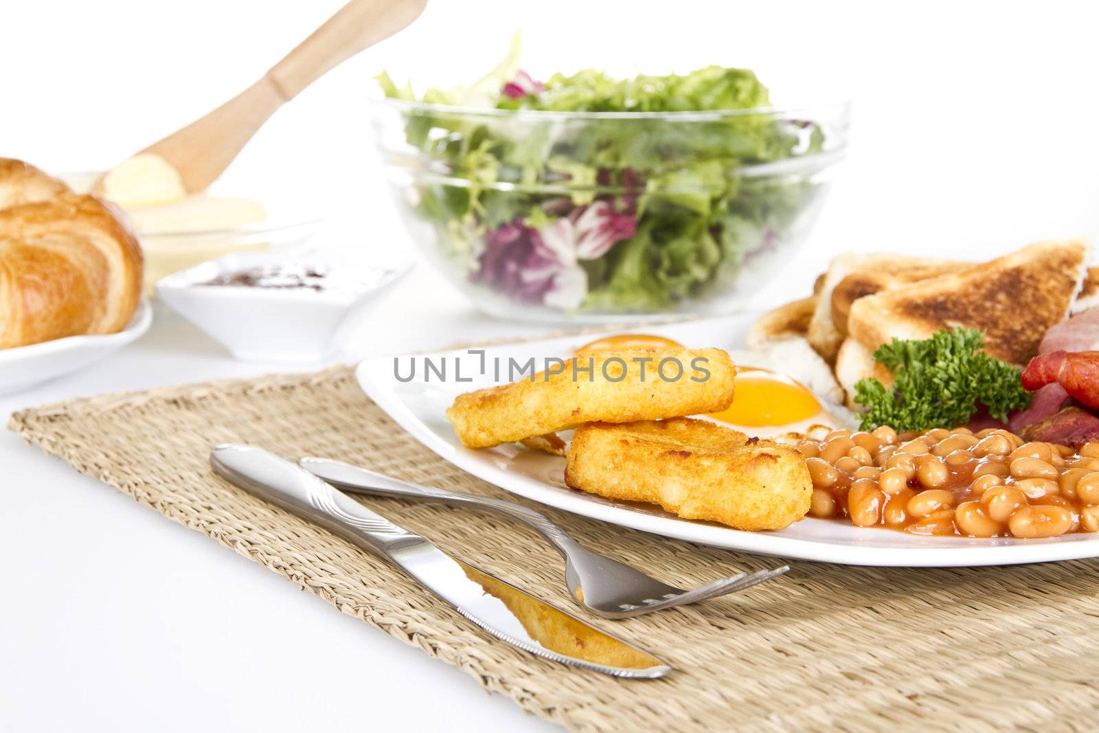 Breakfast with eggs bacon beans and hash browns