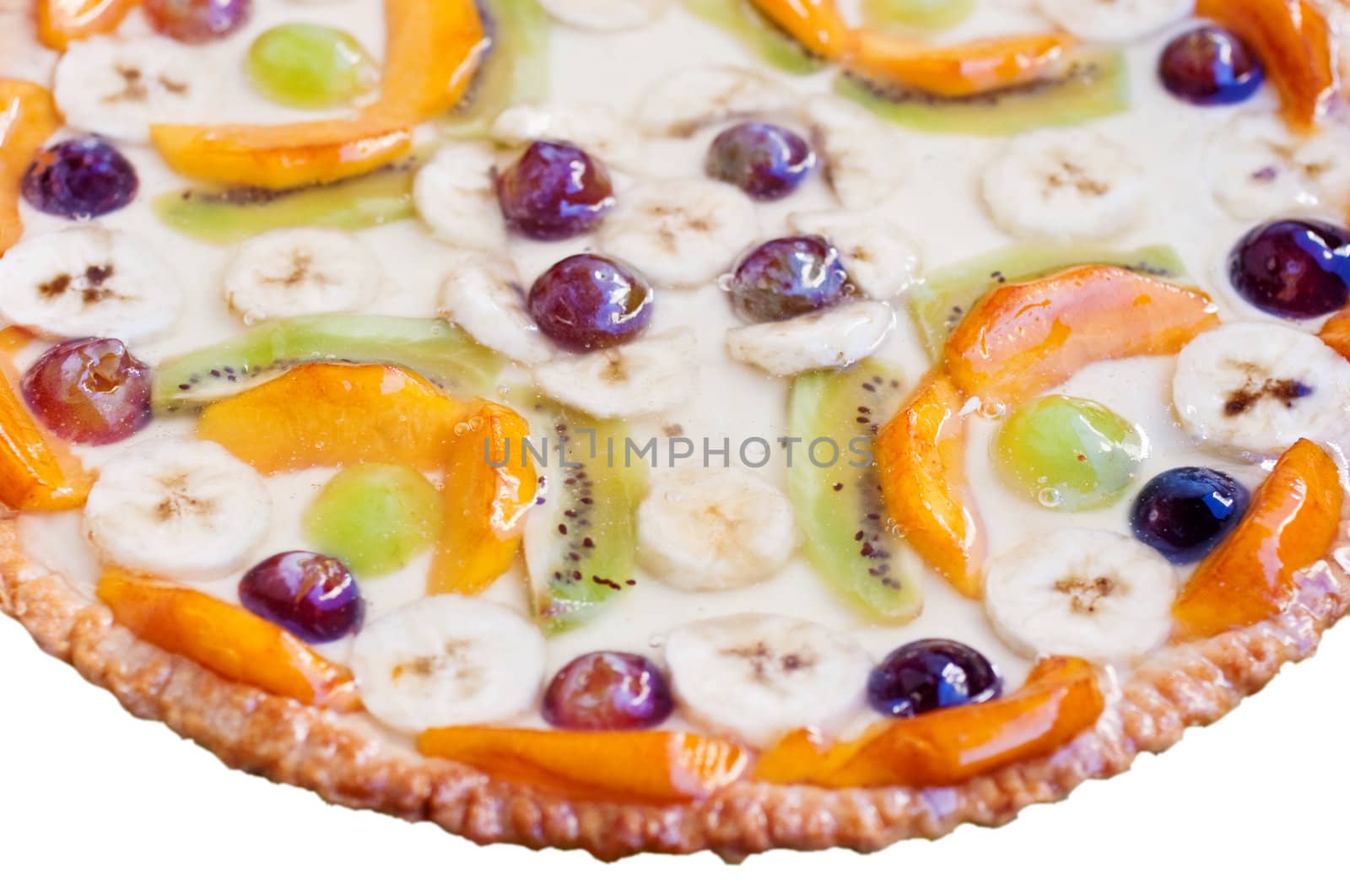 Cake with banana, kiwi, grape, and peaches