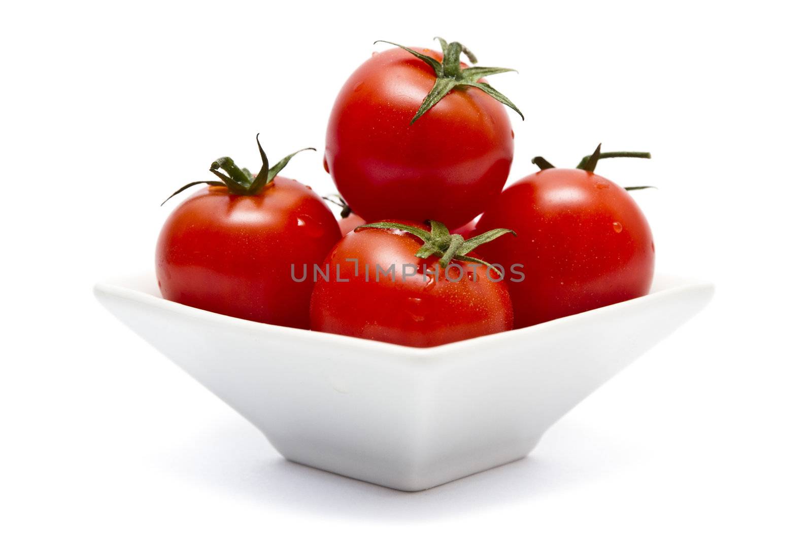 Cherry tomatoes in square bowl by caldix