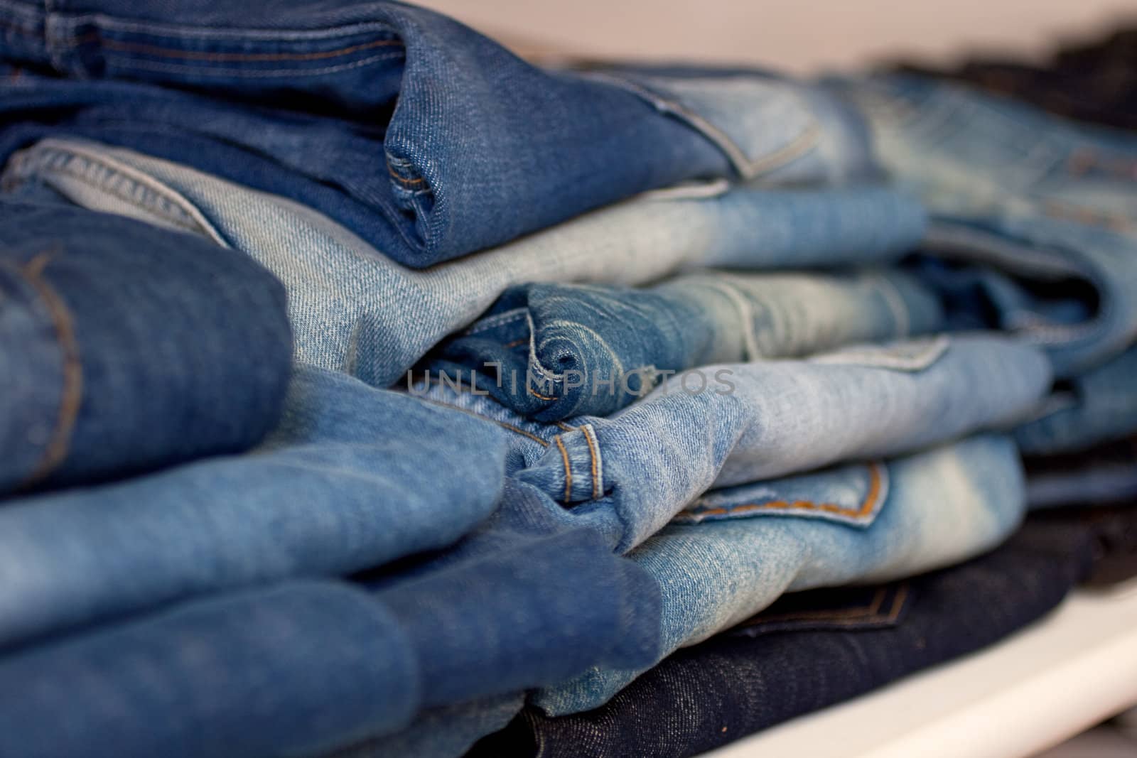 Jeans stacked on a shop