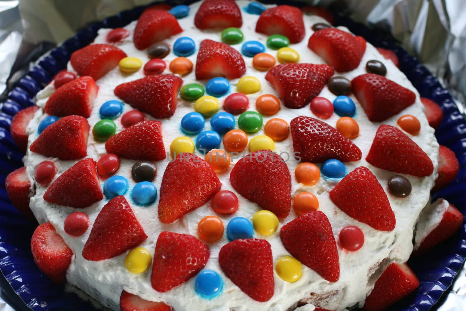 Strawberry cake with colorful candy