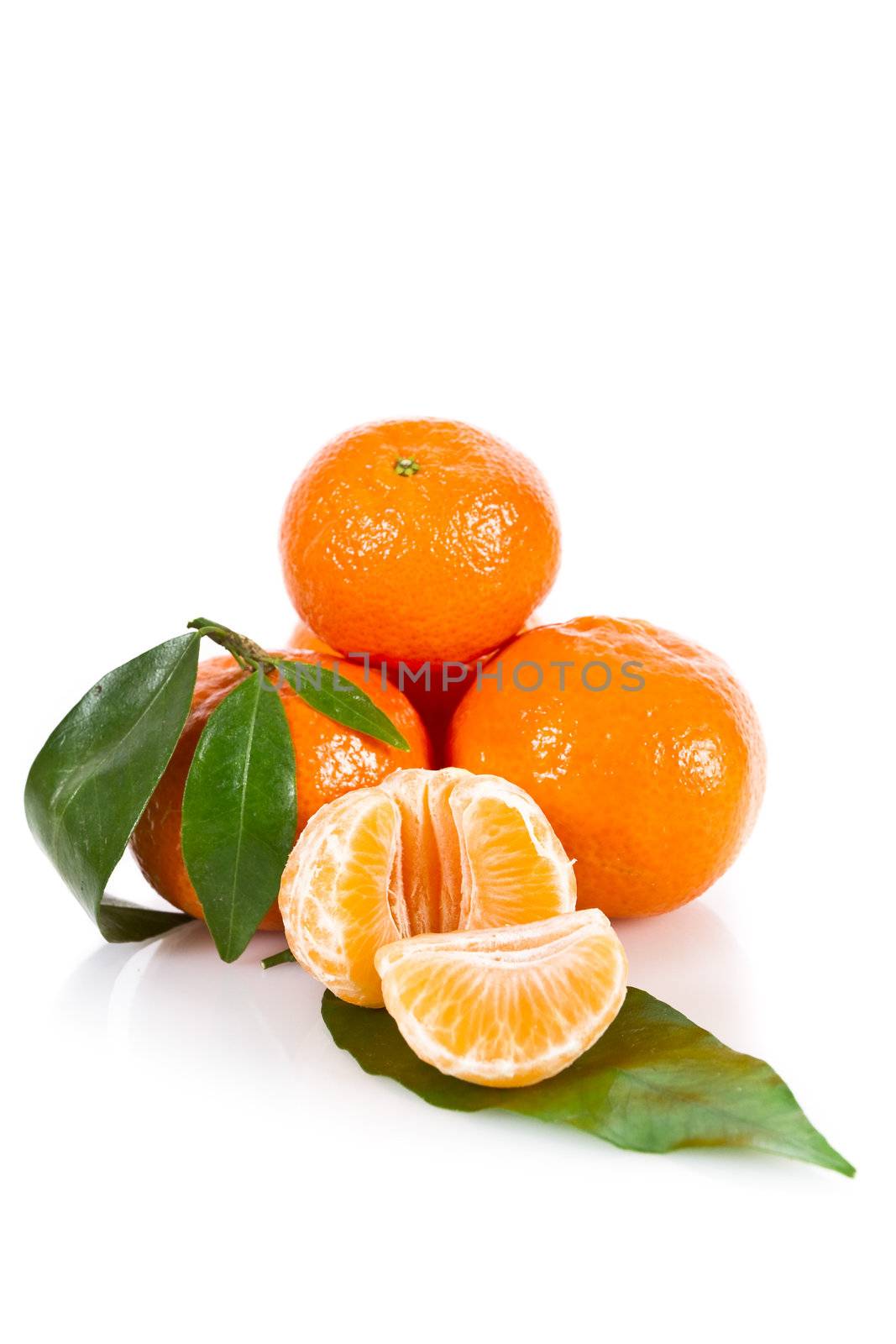 Mandarine fruits with leaves isolated over white