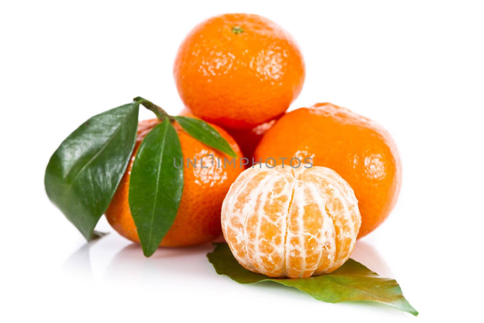 Mandarine fruits with leaves isolated over white