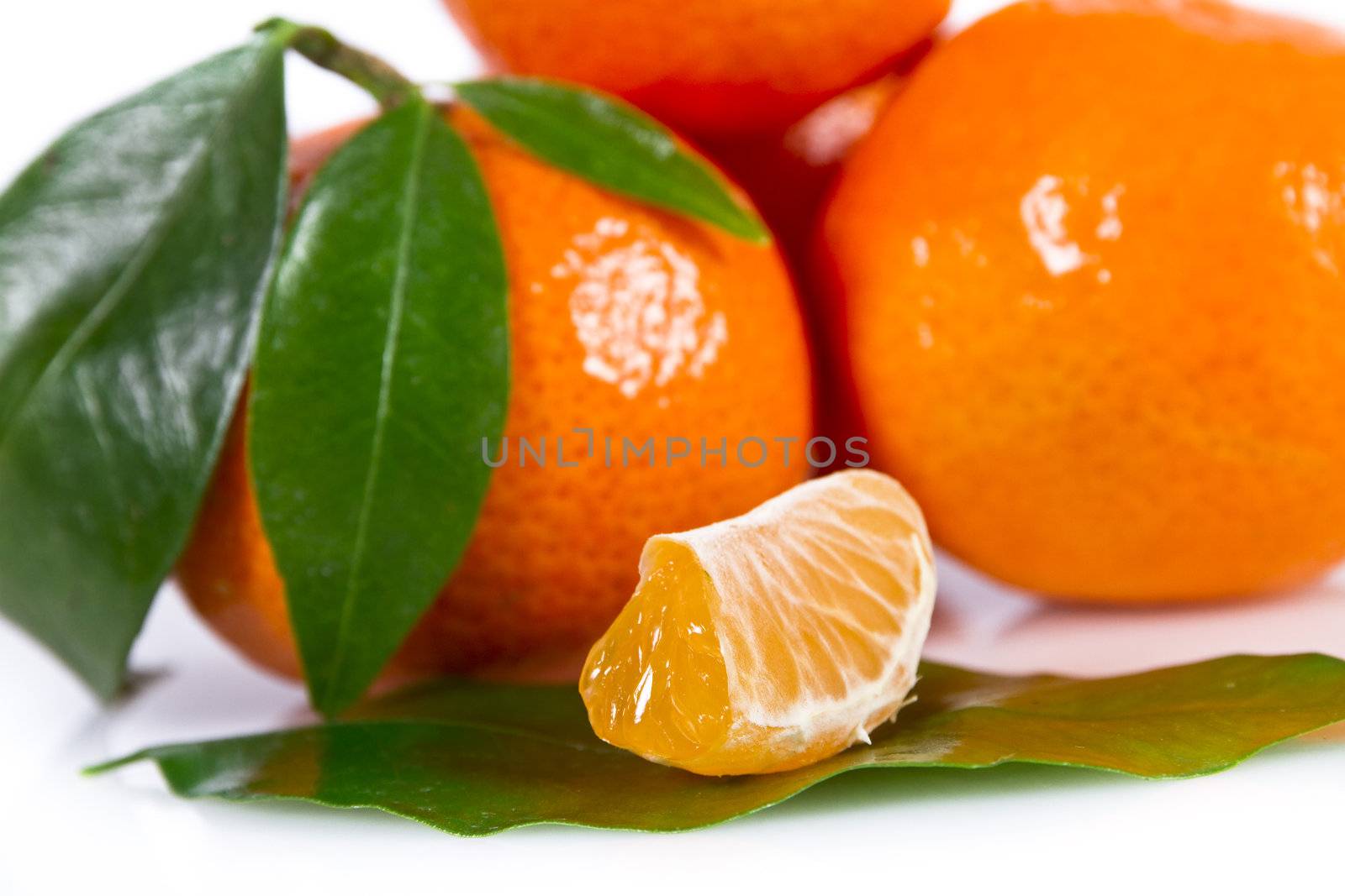 Mandarine fruits with leaves isolated over white