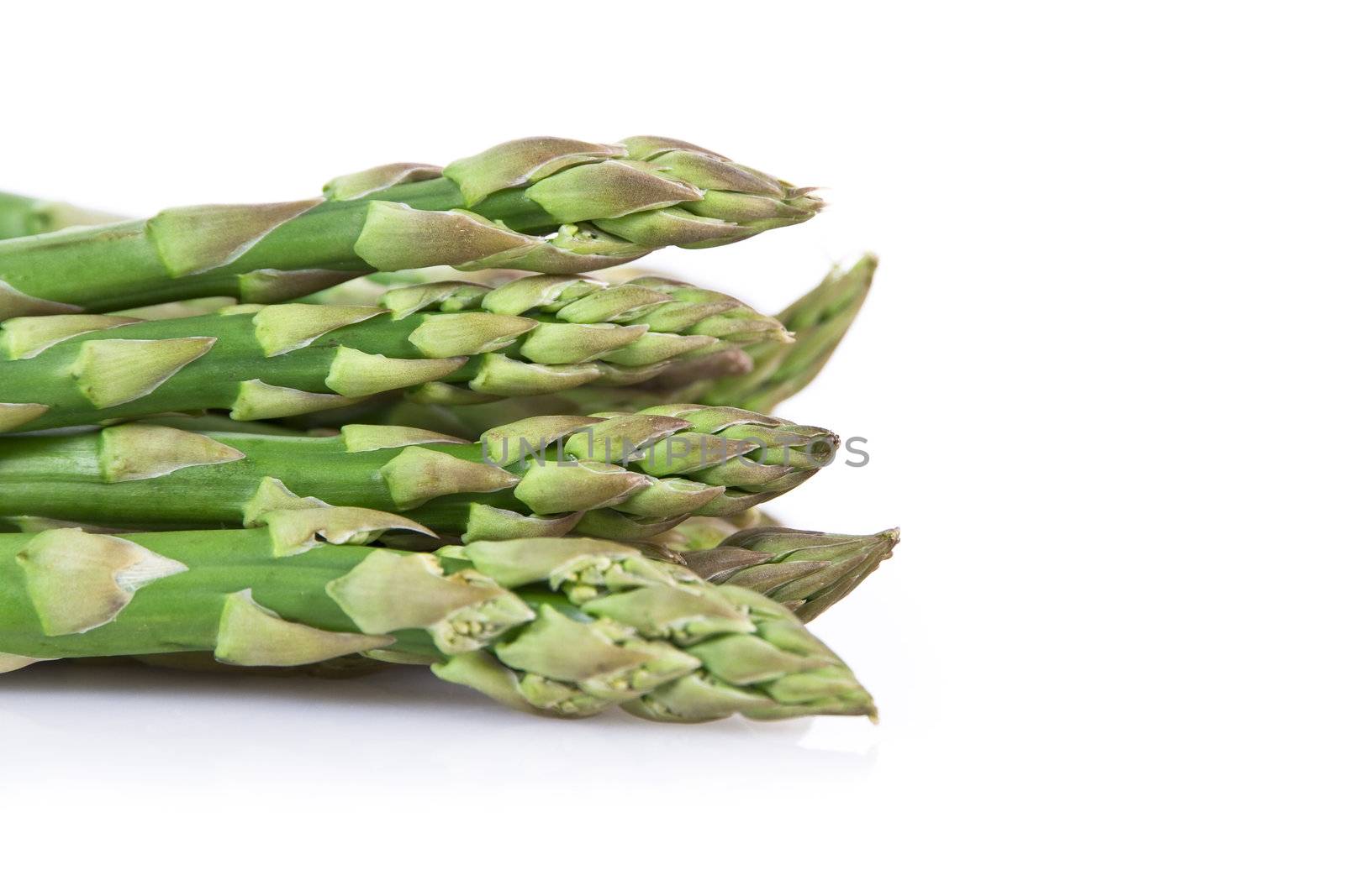 Fresh asparagus isolated over white