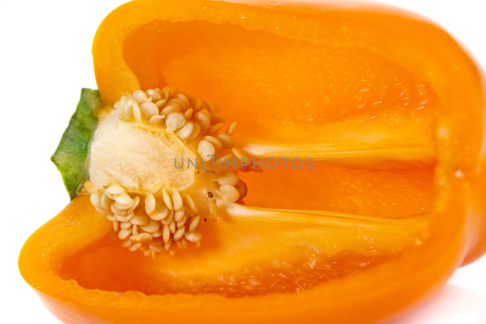 Ripped orange pepper isolated over white