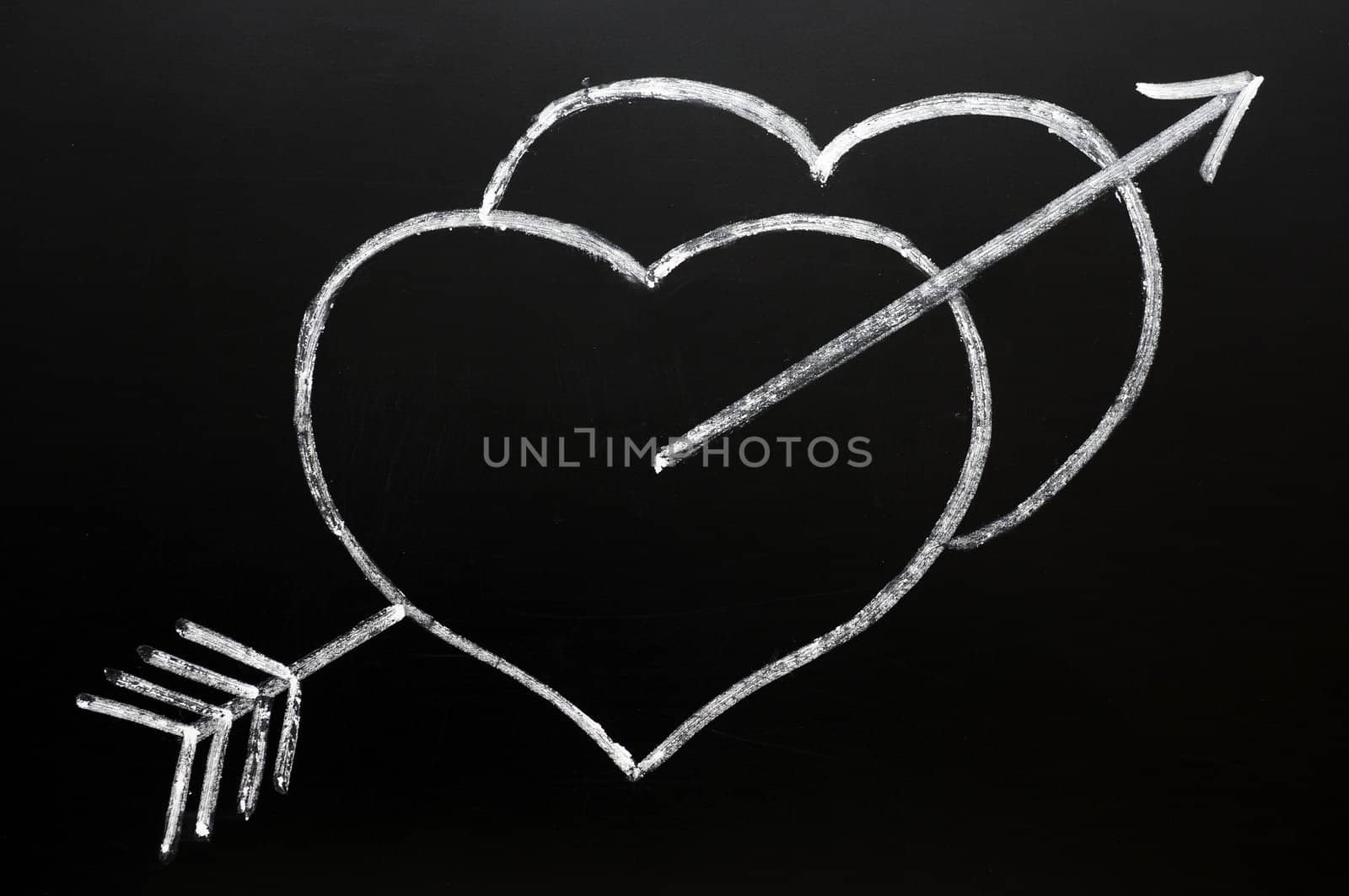 Hearts with Cupid's arrow hitting through, drawn in chalk