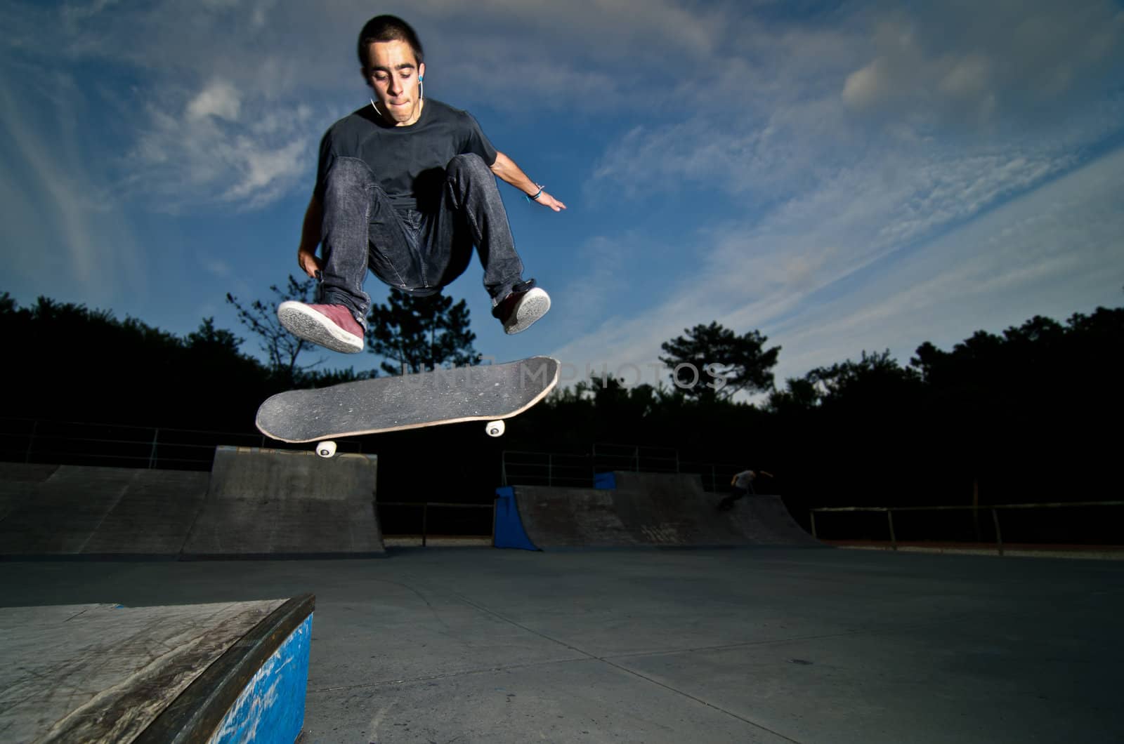 Skateboarder on a flip trick by homydesign