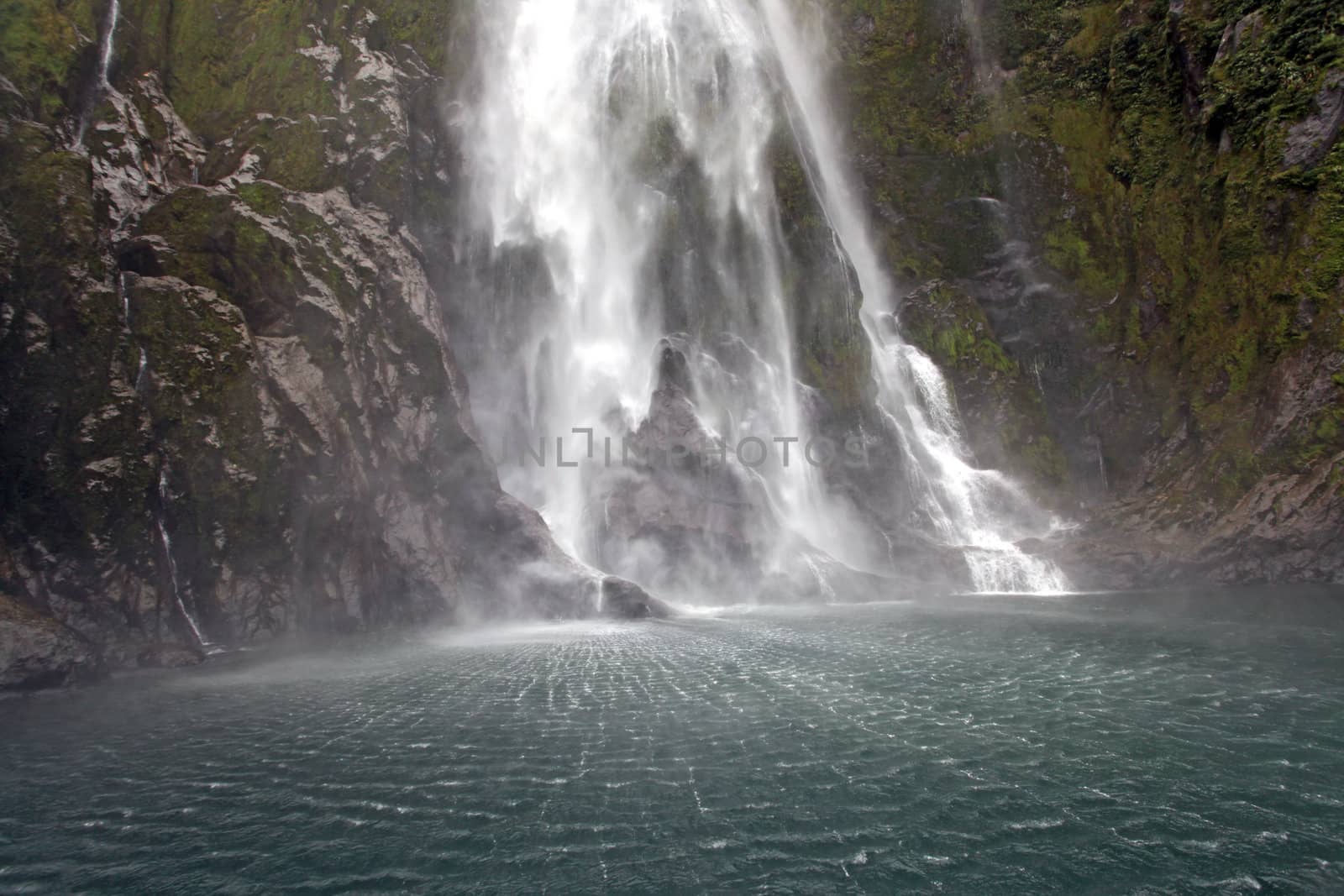 splashing of milford sound waterfall New Zealand