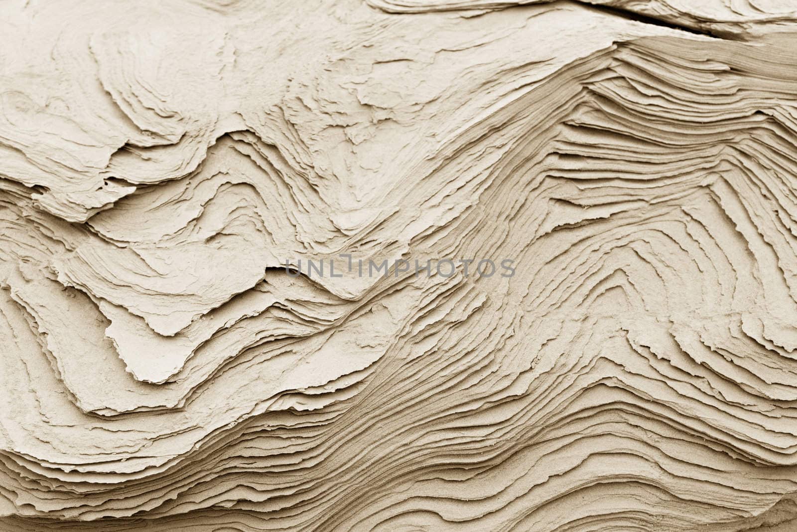 patterns of erosion of sand in the background