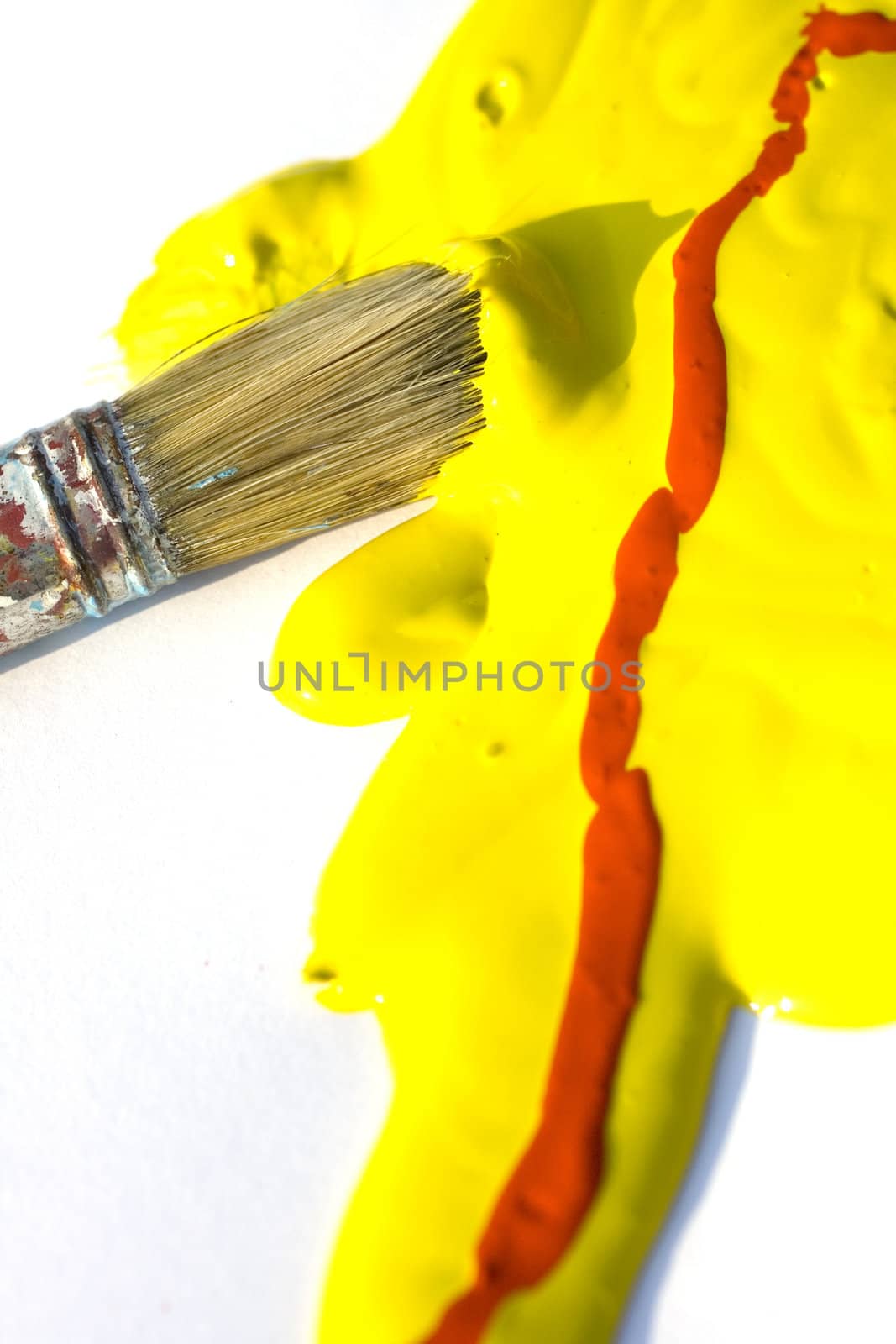 Photo of Yellow and red colors and paintbrush