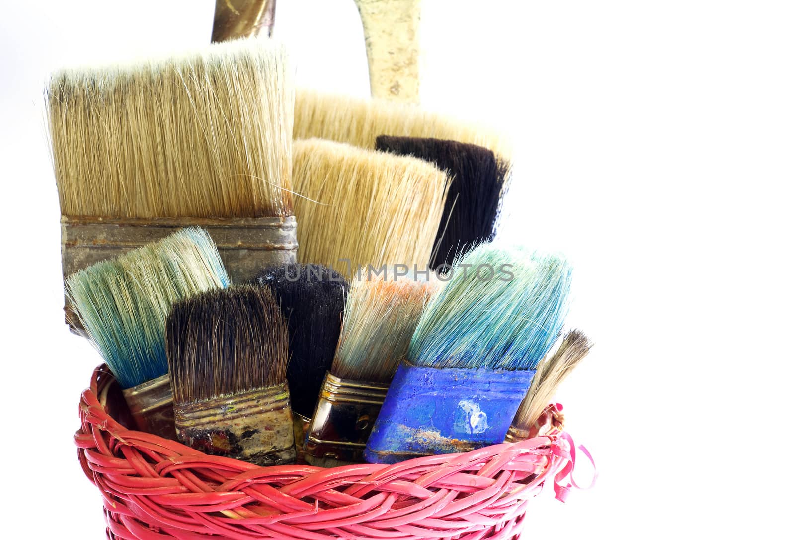 Paintbrushes inside a wicker basket