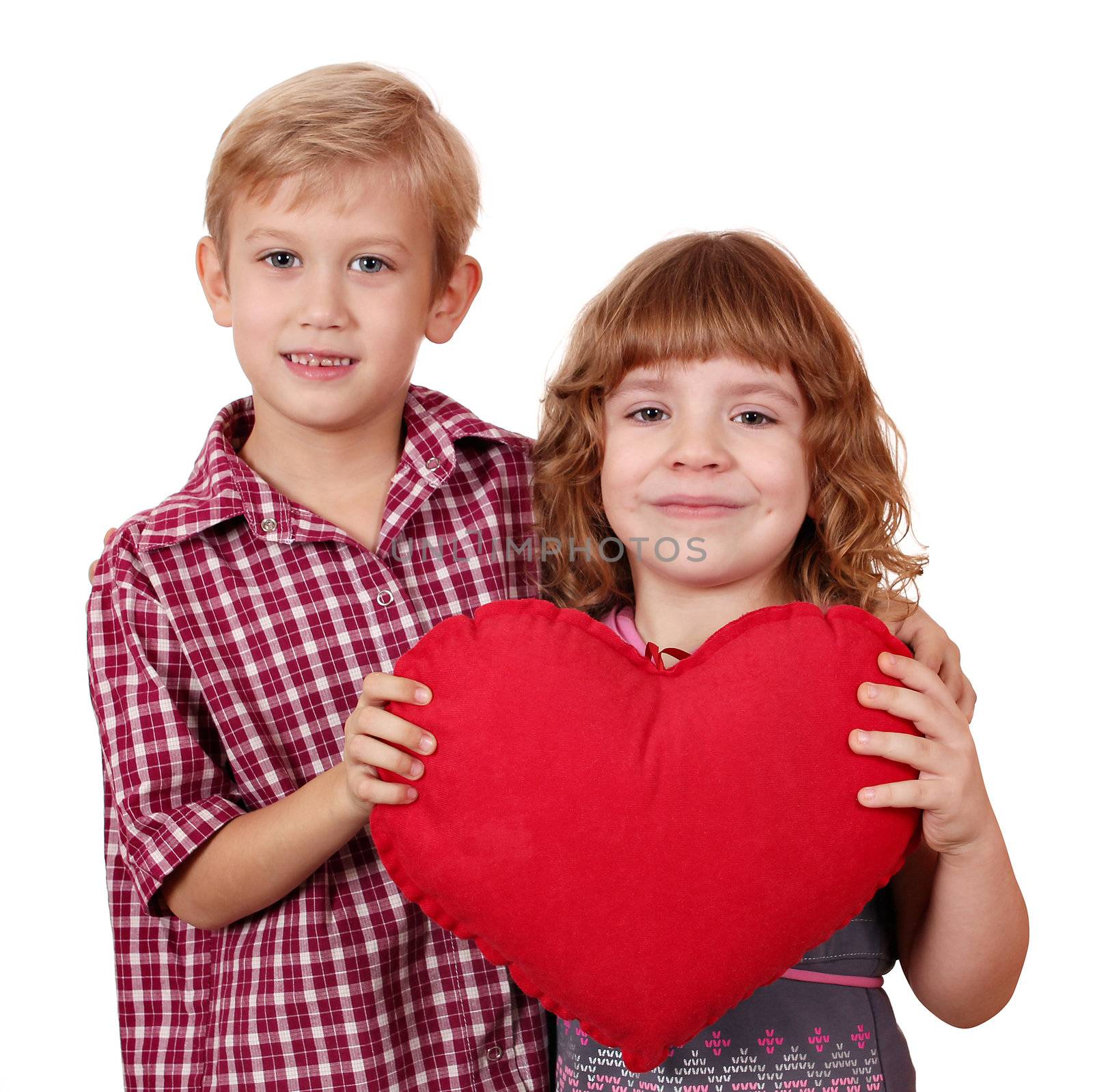 little girl and boy posing with red heart by goce