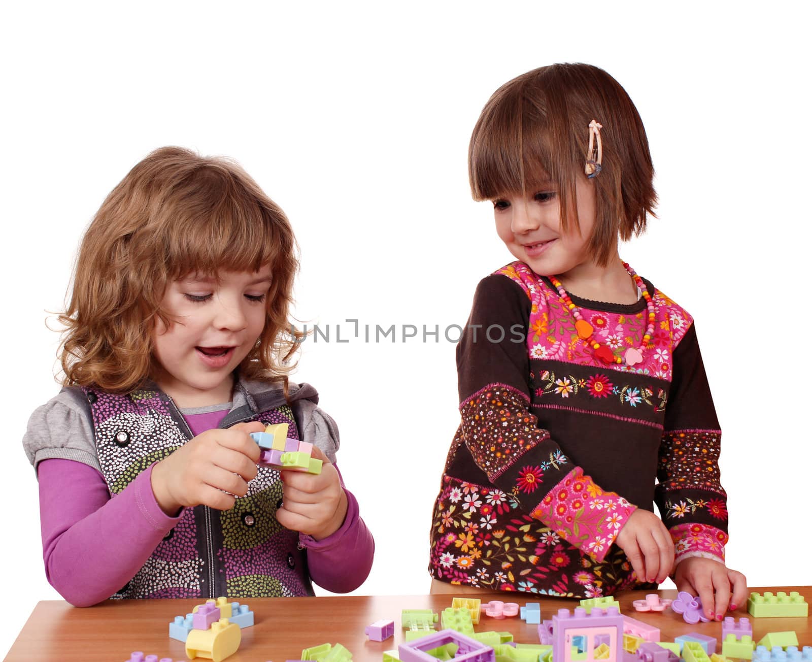 little girls play with toy blocks