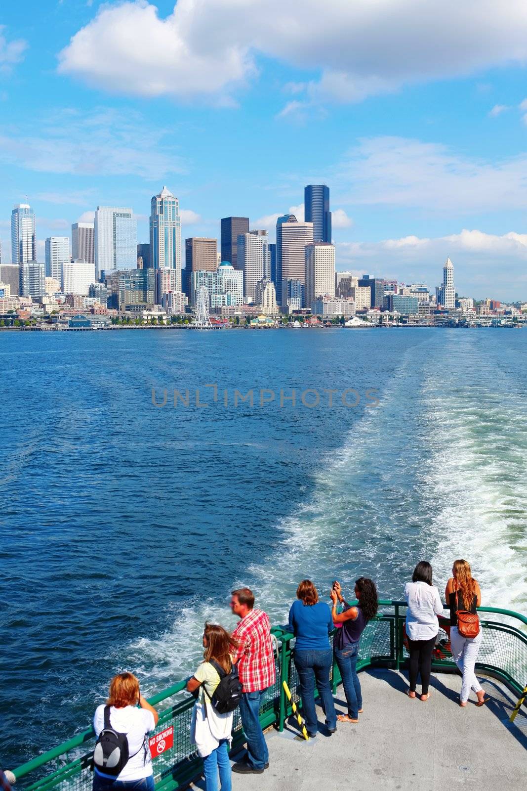Seattle waterfront Pier 55 and 54. Downtown view from ferry.