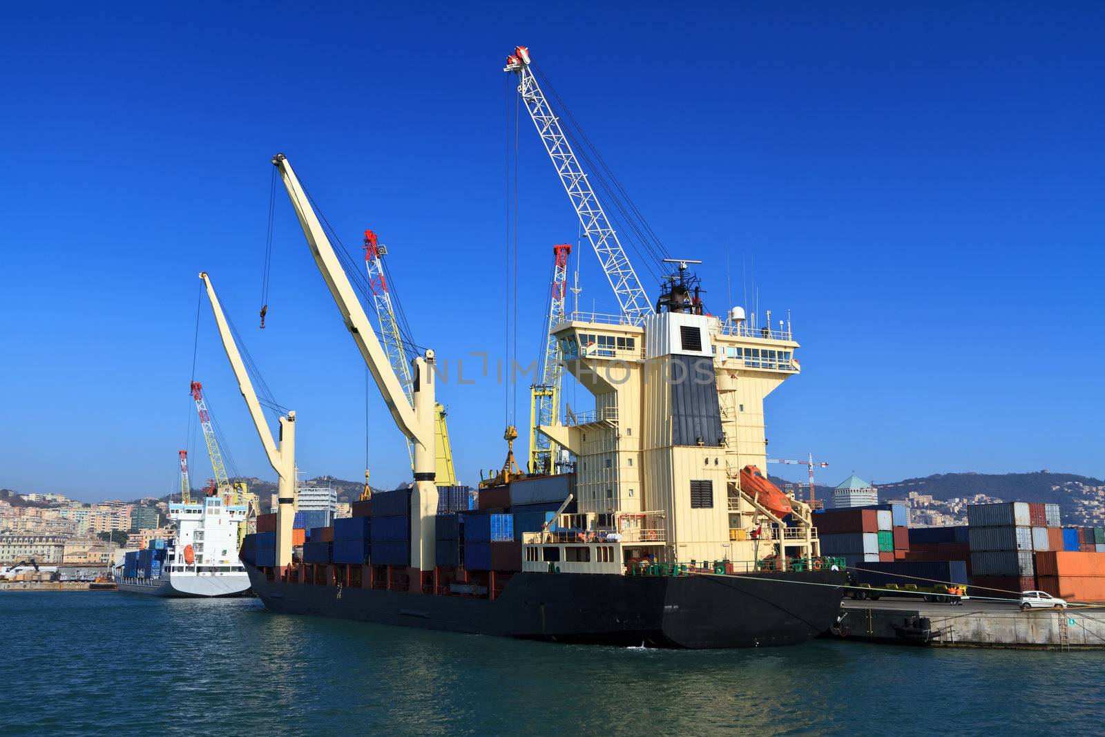 ship is loading containers in Genoa port, Italy.