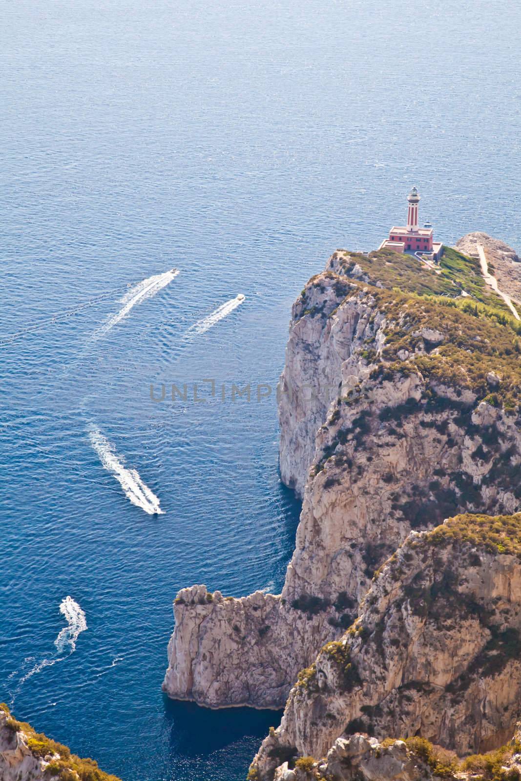 Panorama with Capri lighthouse and boats during a sunny day
