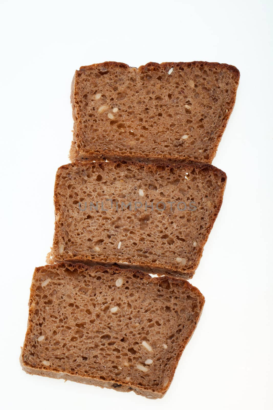 Slices of dark bread isolated over white 