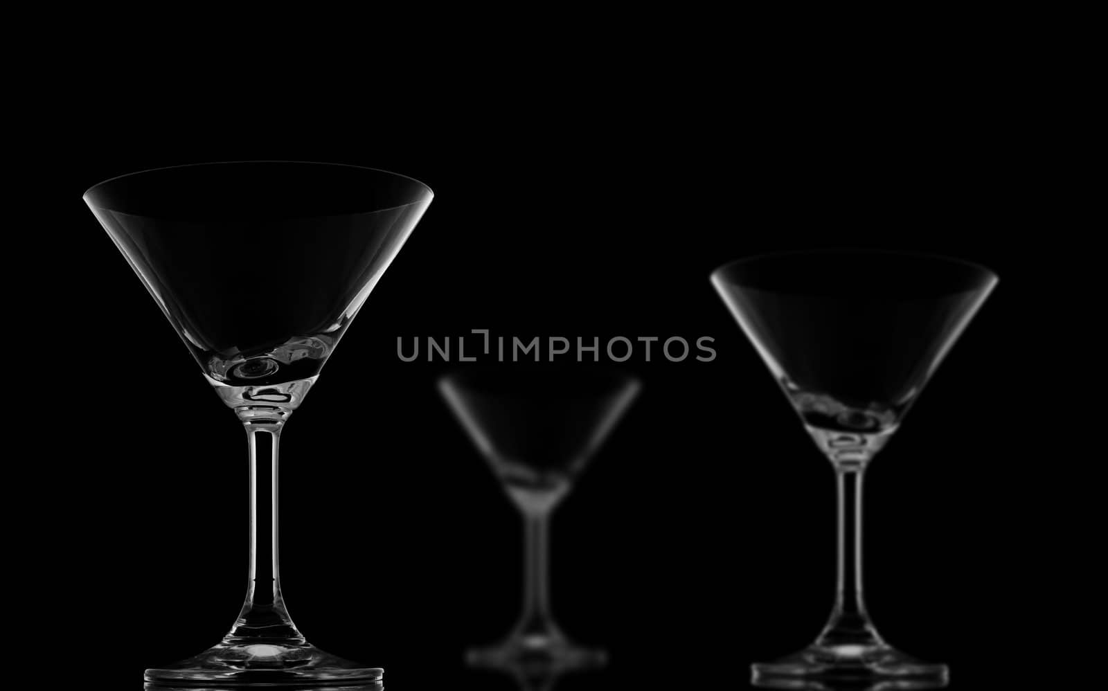 One Sharp and Two Blur Cocktail glasses on black background and  by nuttakit