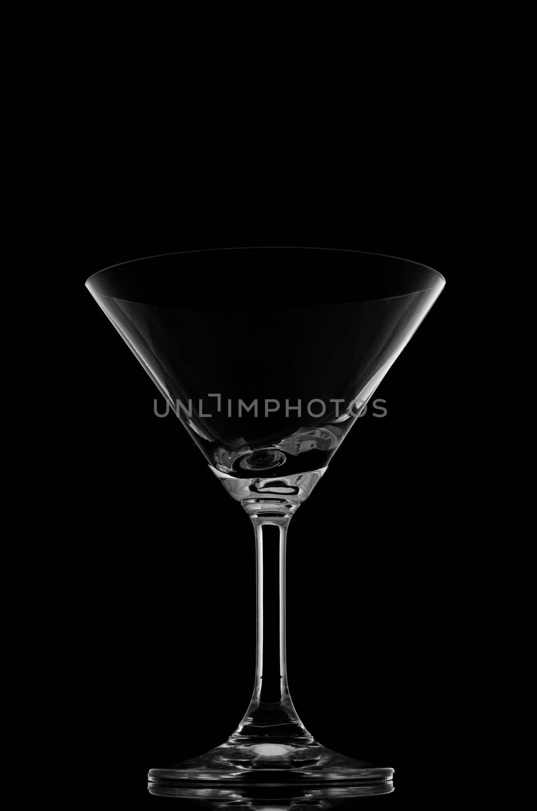 Cocktail glasses on black background and reflection