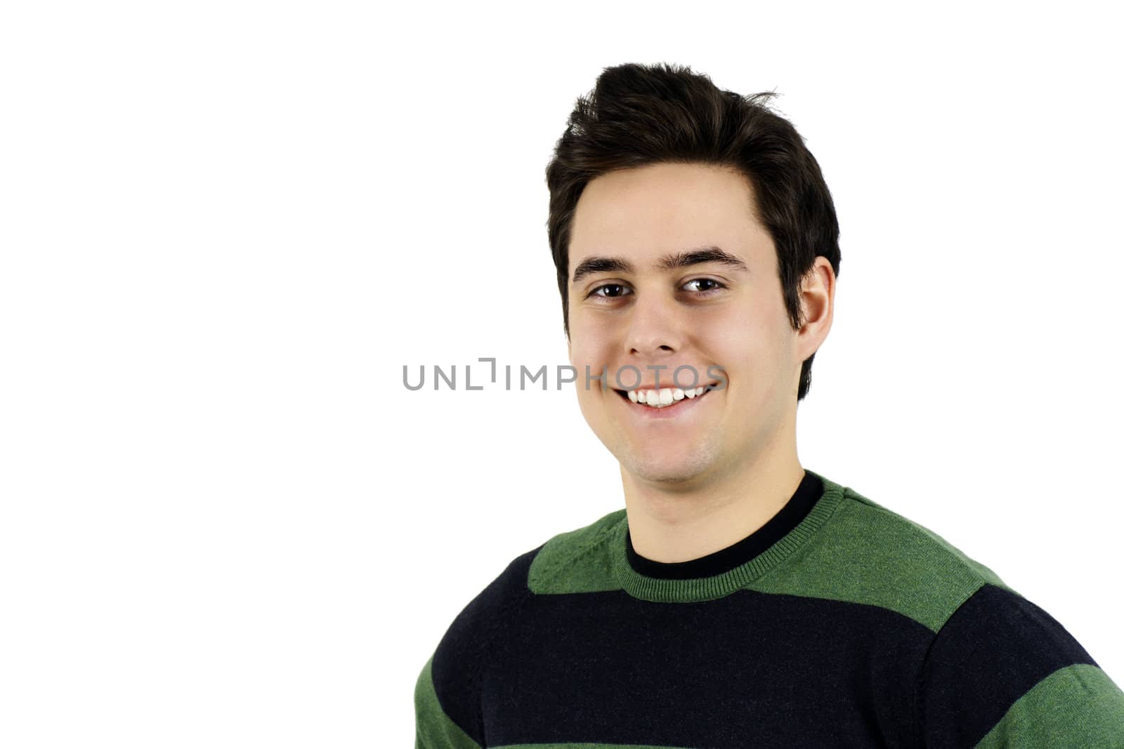 Portrait of a charming young man smiling at the camera, can be student.