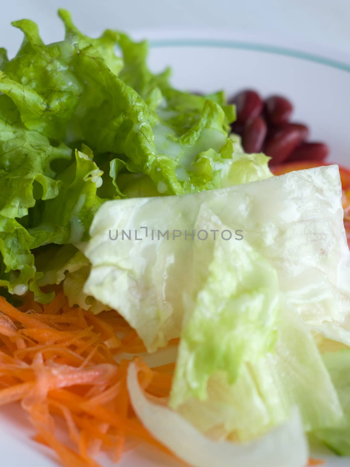 Vegetable Salad in White plate and panels with drink