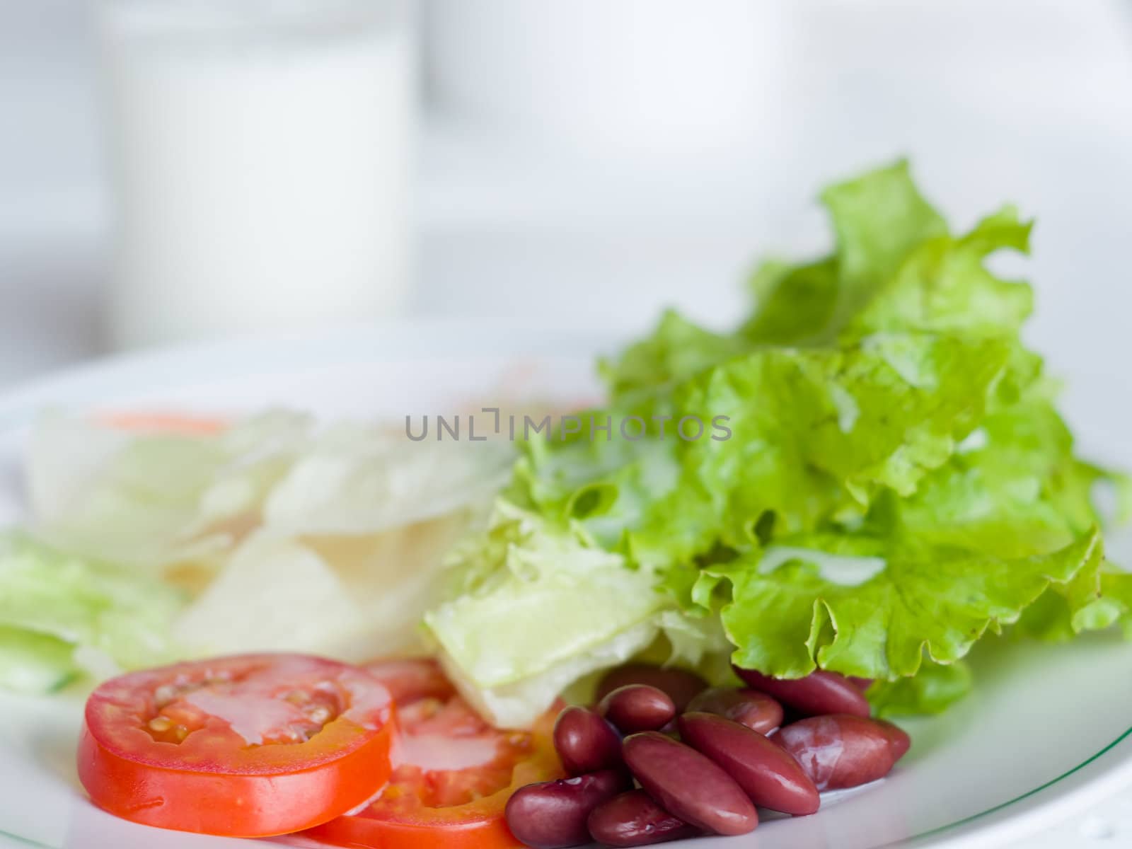 Vegetable Salad in White plate and panels with drink