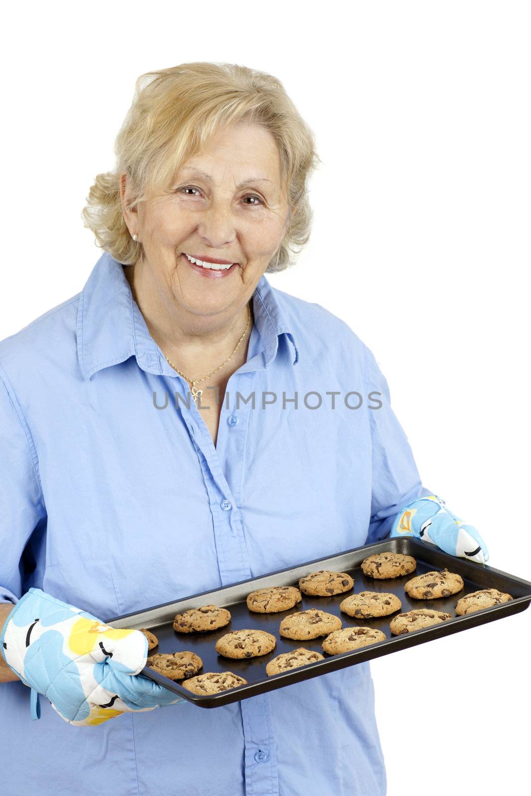 Mother and grand-mother welcoming her family with a smile and freshly baked home made chocolate cookies.