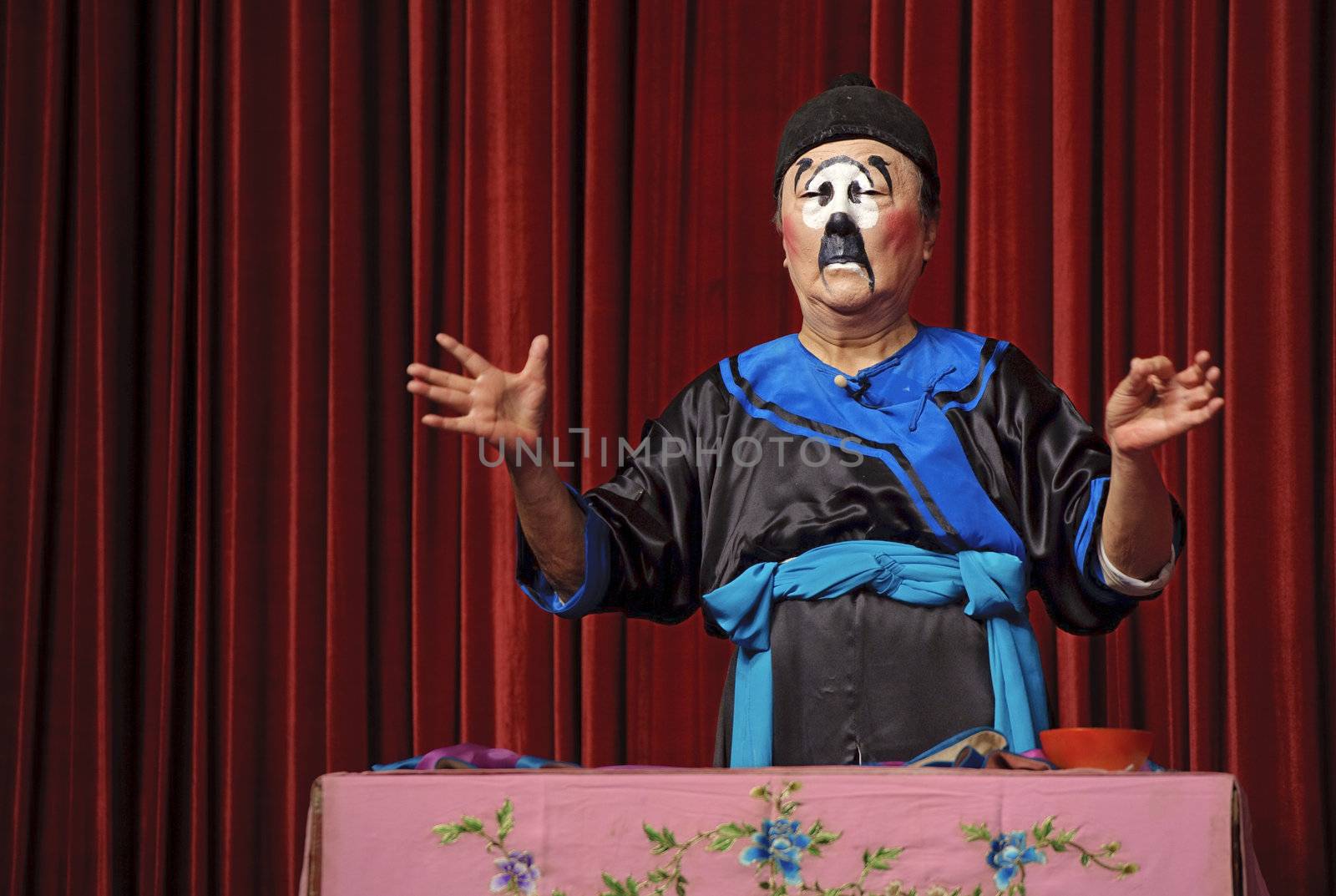 CHENGDU - JUN 5: chinese traditional mime actor performs on stage at Chongzhou theater.Jun 5, 2011 in Chengdu, China.