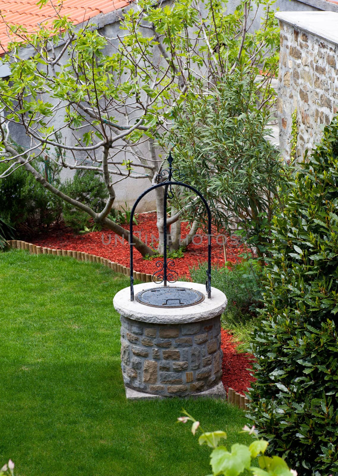 Well in the back of a house with garden