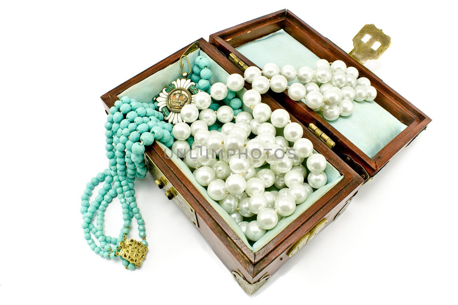 Wooden treasure chest with jewelry isolated on white