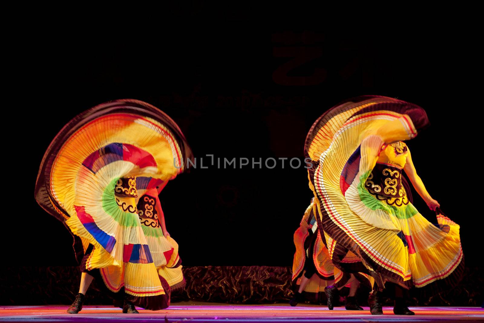 CHENGDU - SEP 28: chinese Yi ethnic dancers perform on stage in the 6th Sichuan minority nationality culture festival at JINJIANG theater.Sep 28,2010 in Chengdu, China.