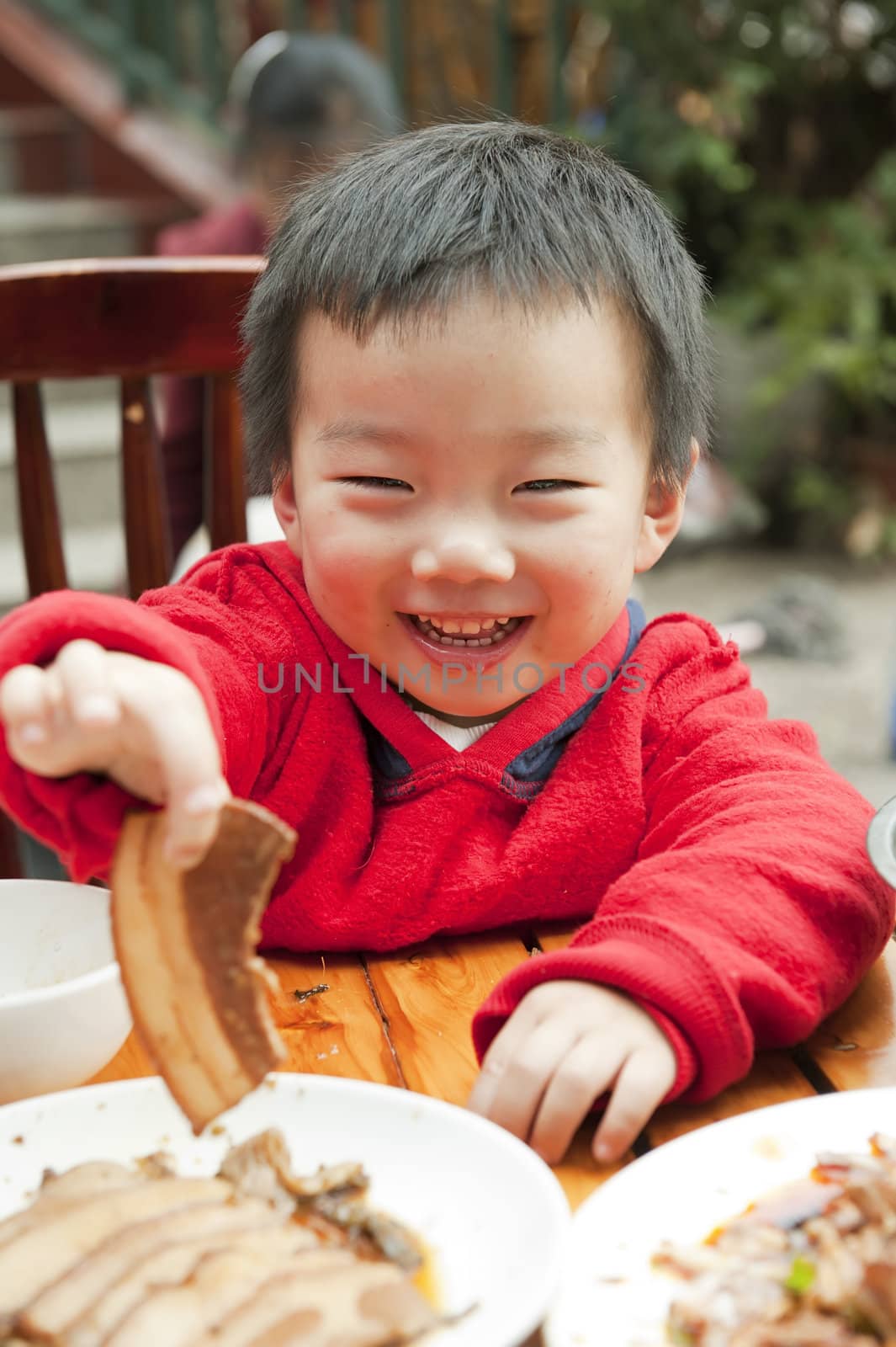 a cute baby is eating