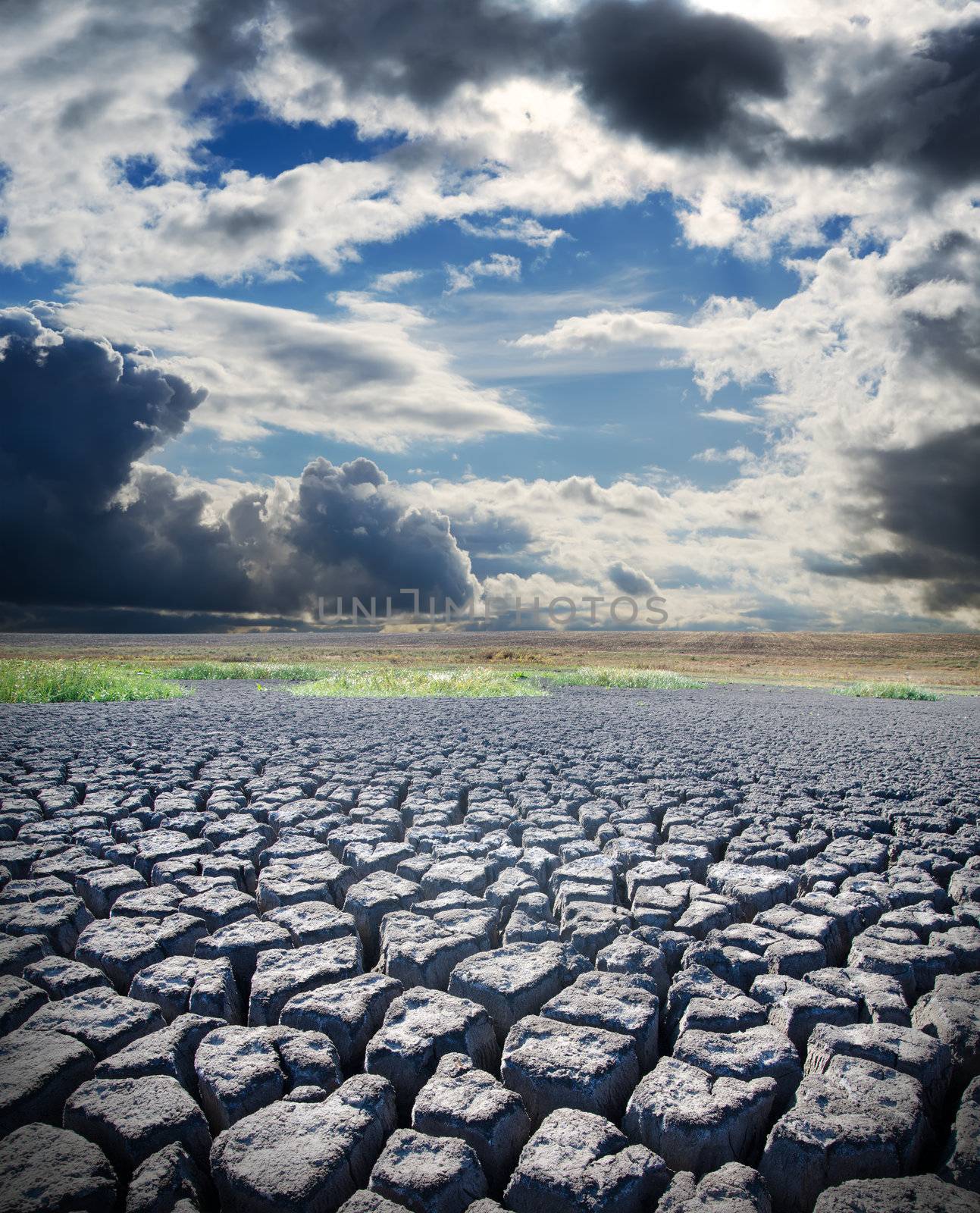 view to dry lake and dramatic sky over it by mycola