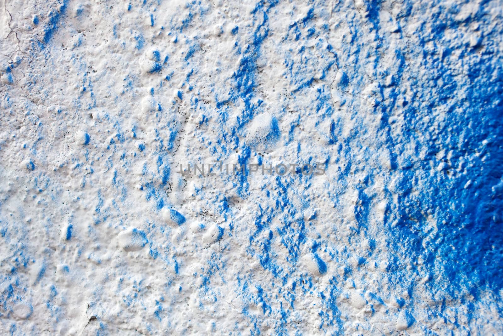 Blue color on a white wall