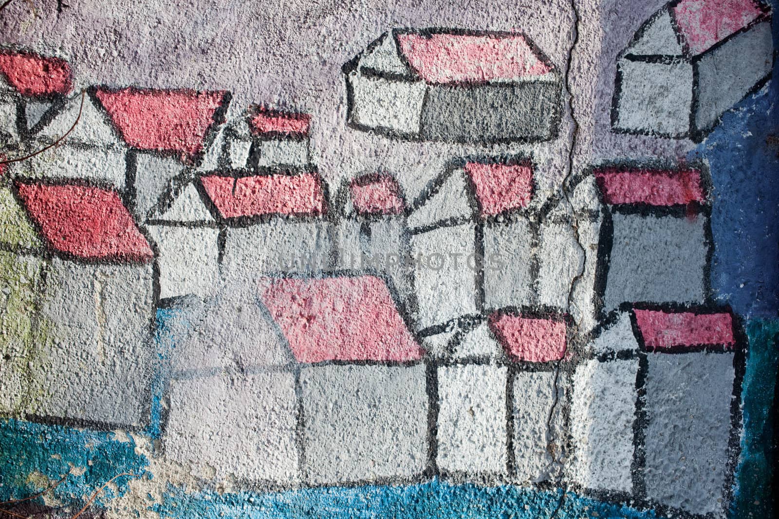 Graffiti, stylized houses painted on the wall