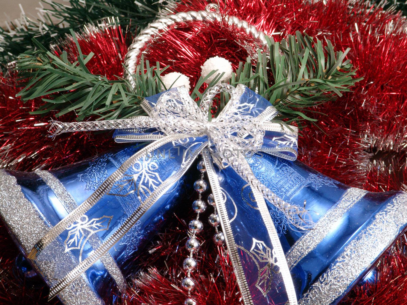 Decorative blue christmas campanellis on a background garlands                      