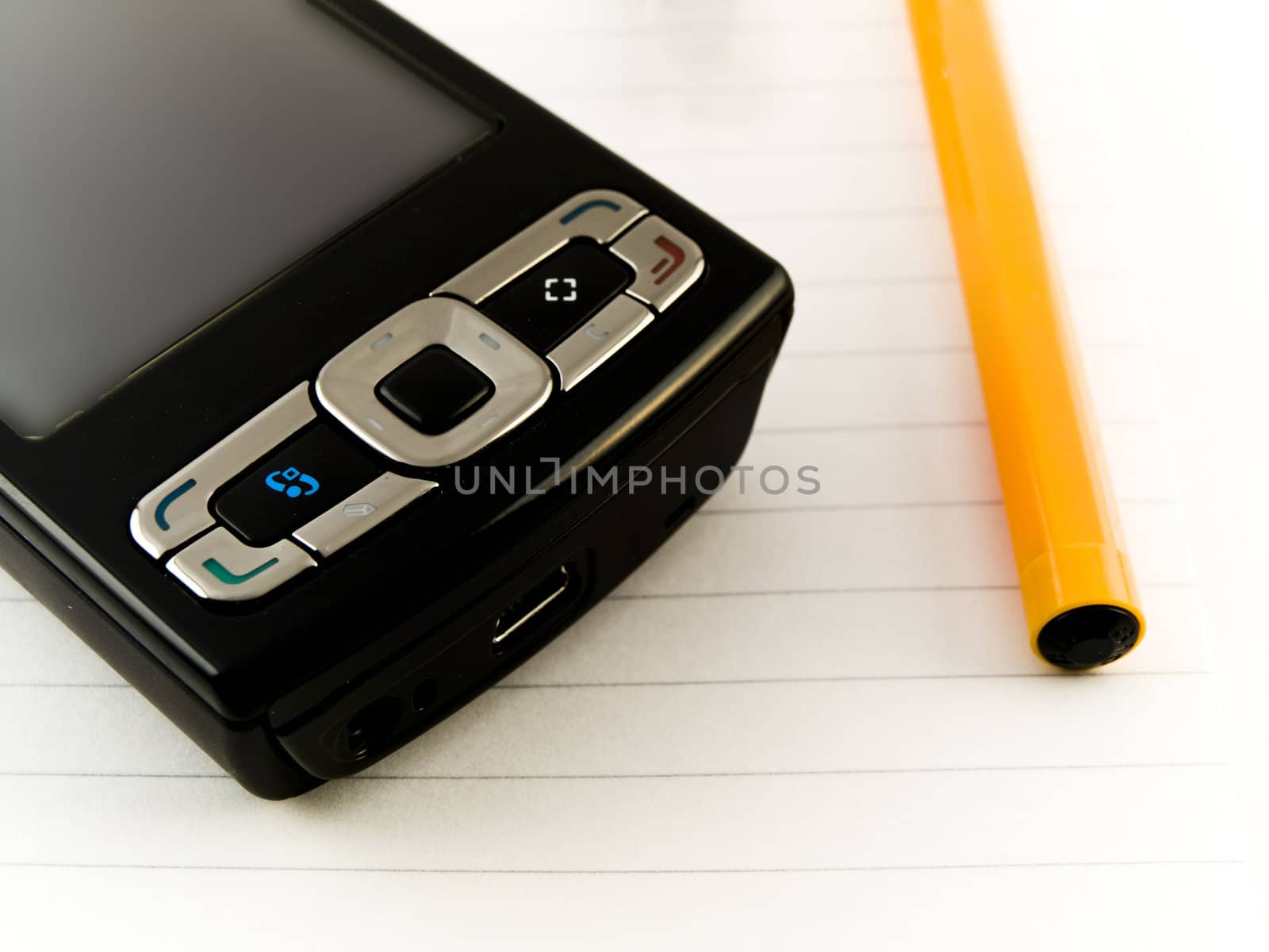 Ballpoint Pen and Mobile Phone on Notepad White Background