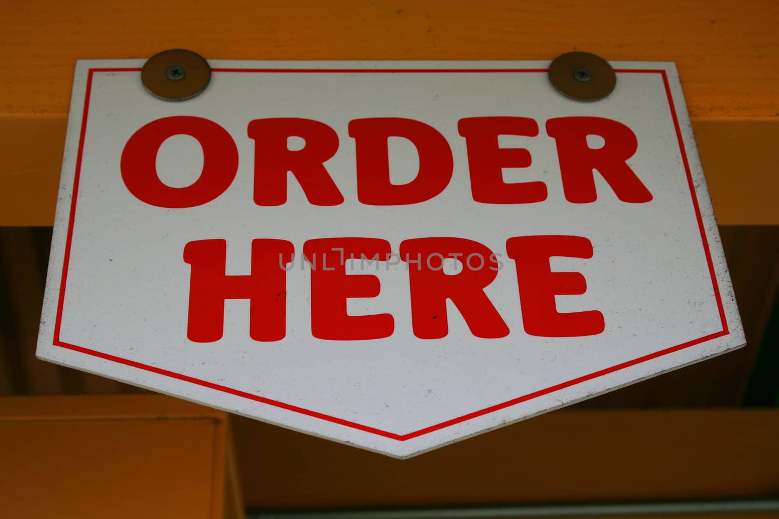 Close up of an order here sign.
