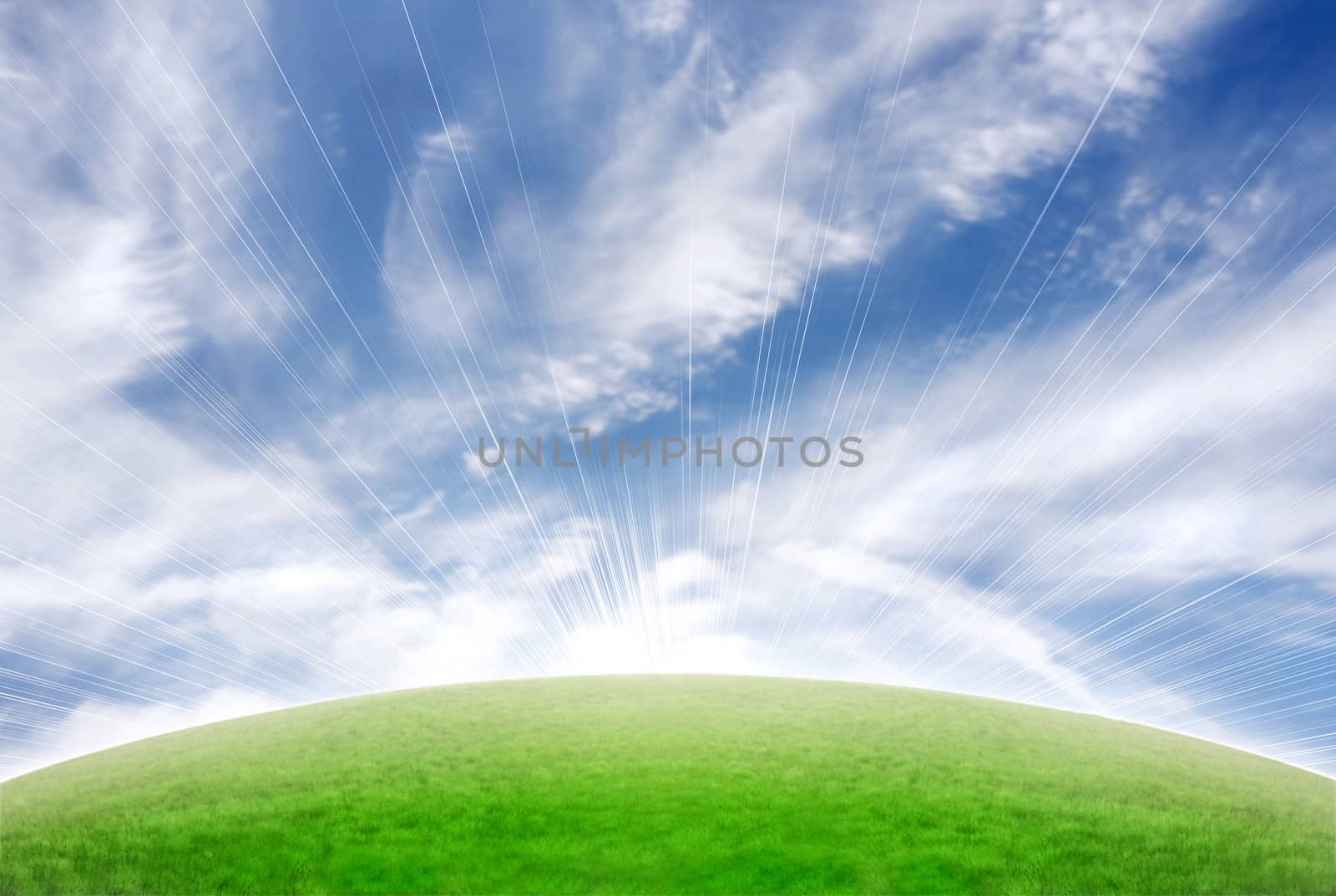 Beautiful sceneric background with green hill and blue cloudy sky. Sun flare in the middle of the slope.