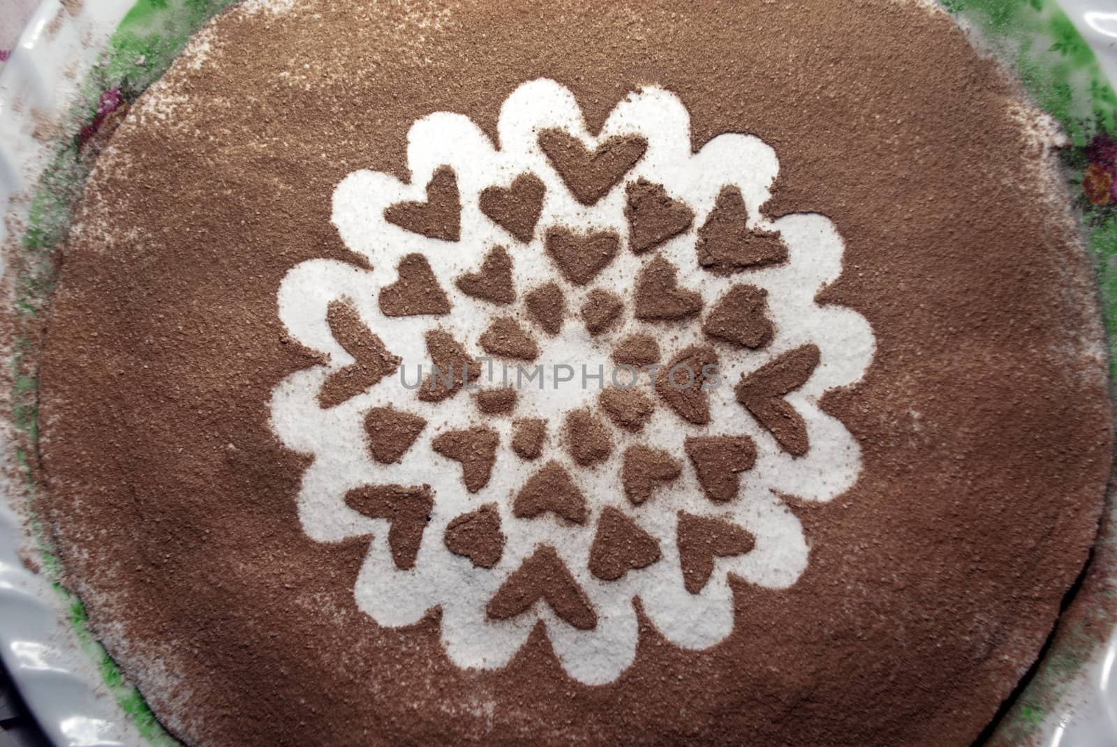 Sweet chocolate cake in a heart shape.