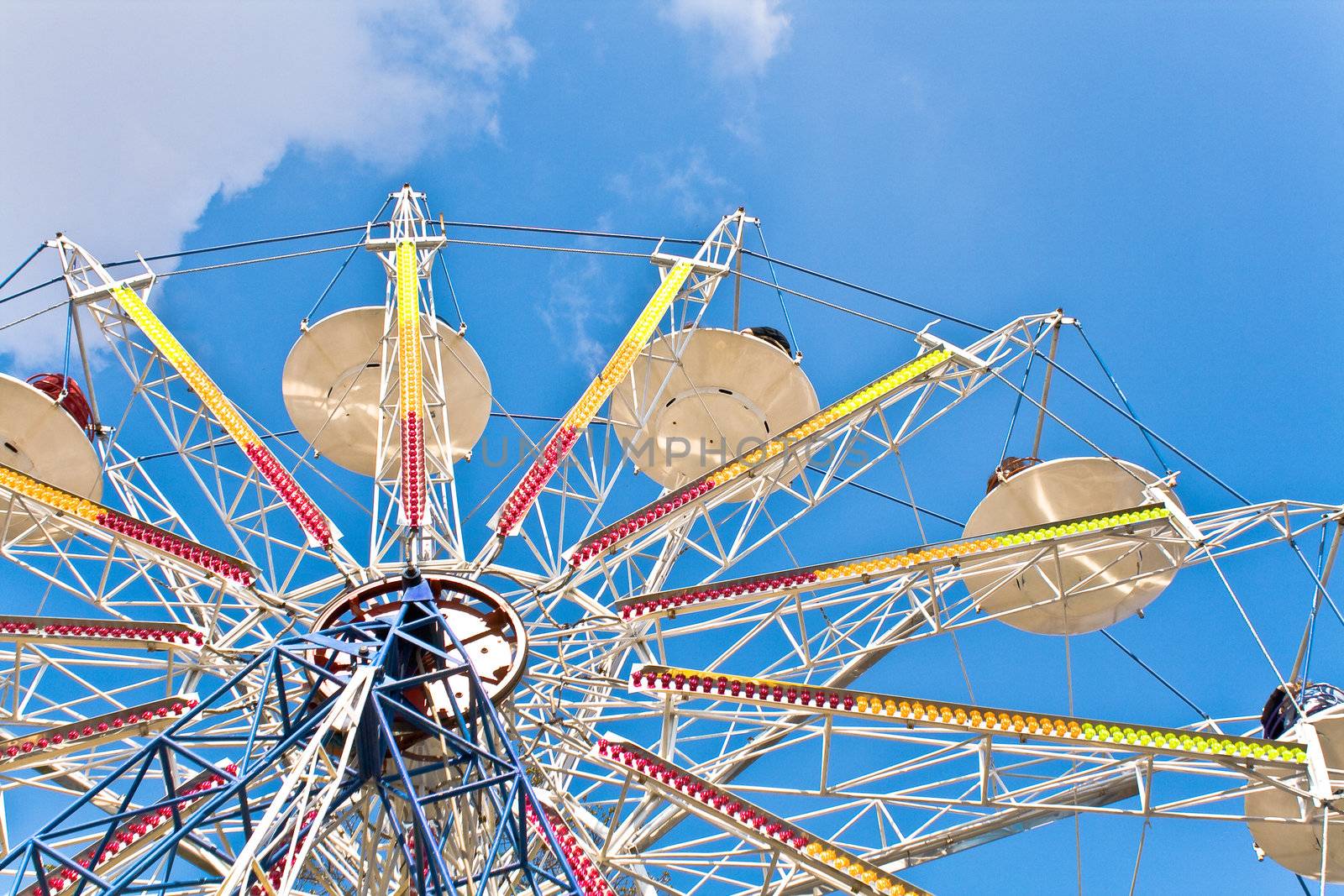 Ferris Wheel on a blue sky by gavran333