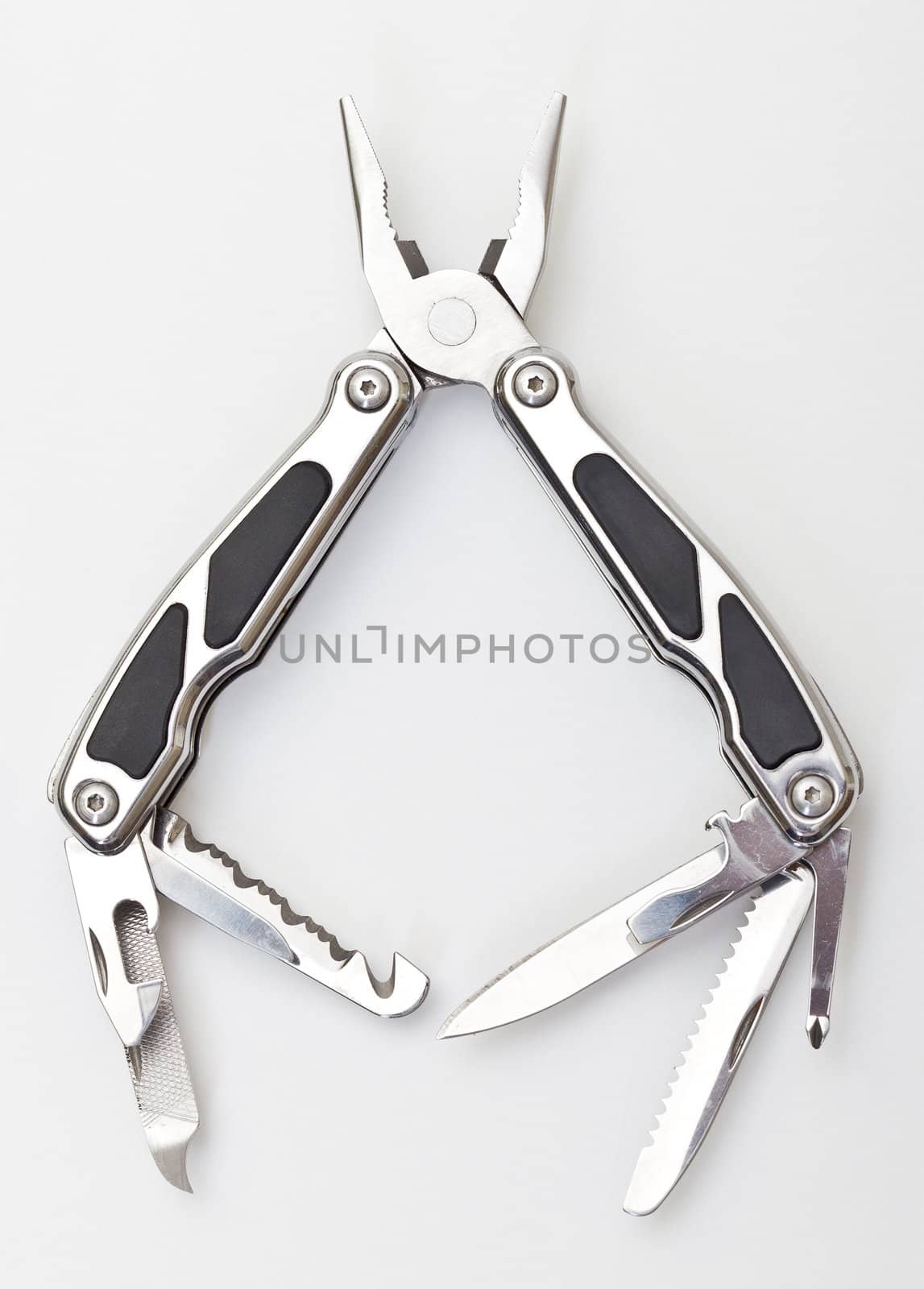 Steel pliers folding multi tool opened on white background