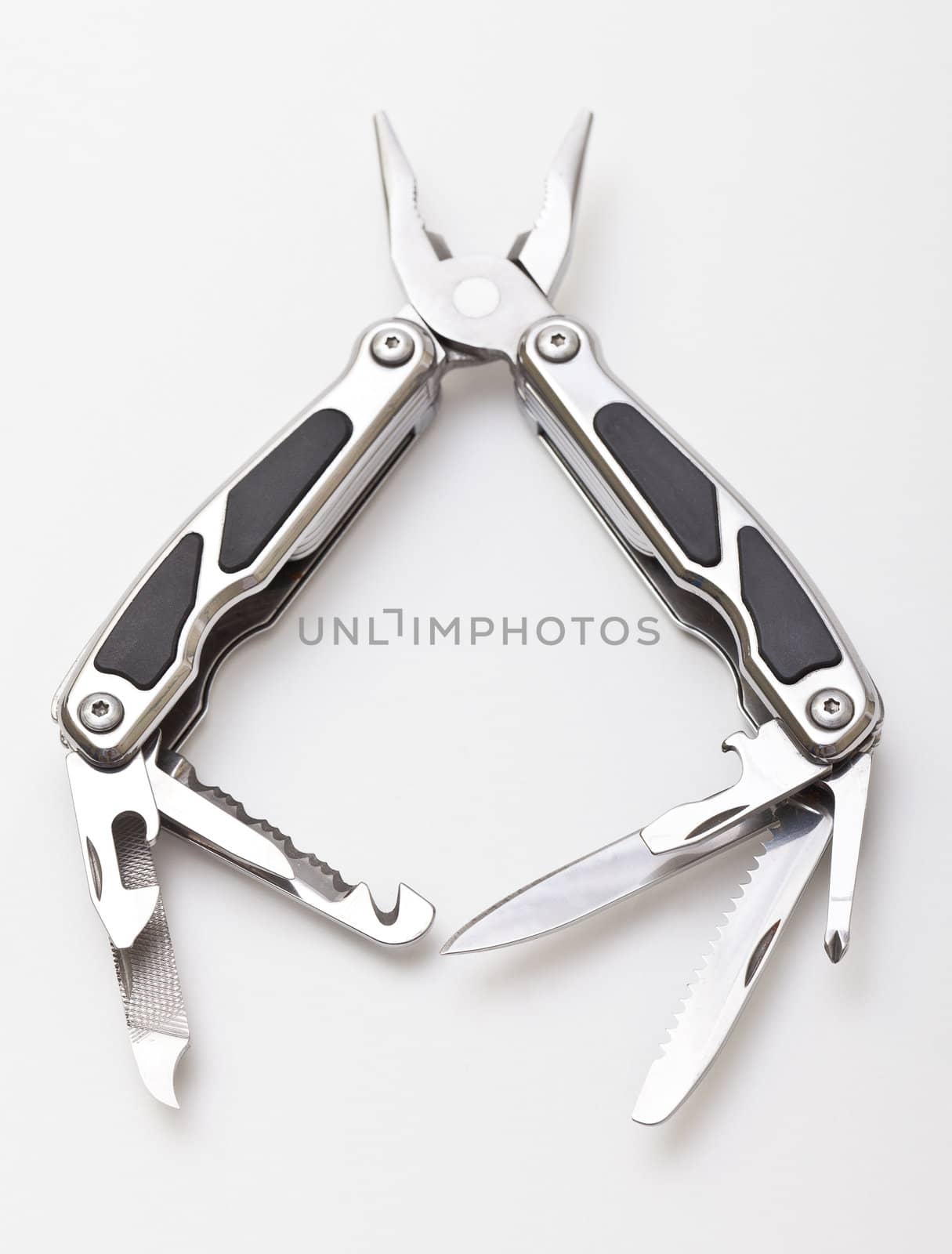 Steel pliers folding multi tool opened on white background