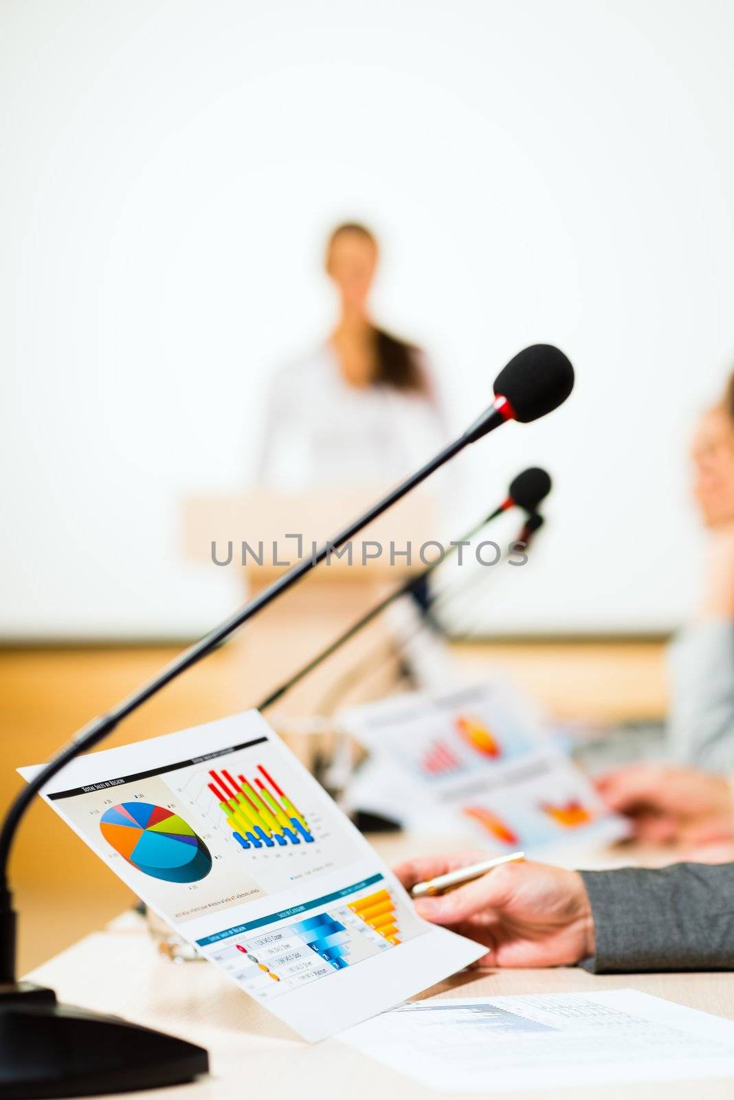 close-up microphone, on the background of business communication at the conference